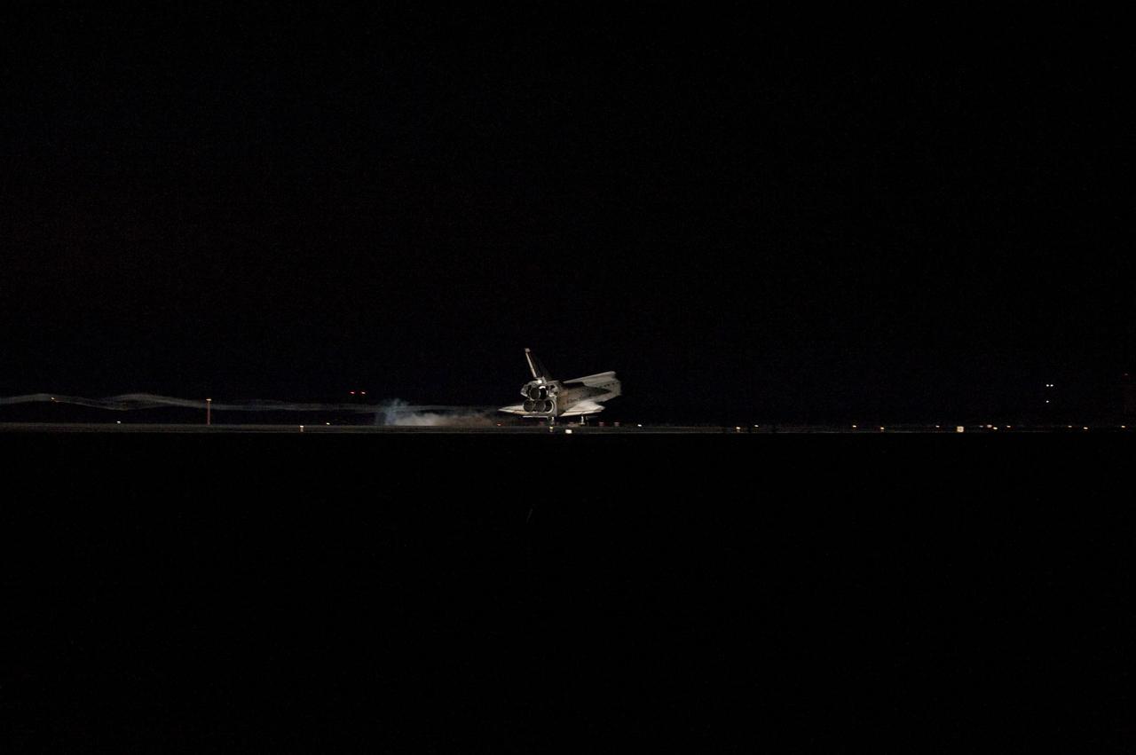 CAPE CANAVERAL, Fla. -- Space shuttle Atlantis' bright-white, iconic frame illuminates the darkness as it touches down on the Shuttle Landing Facility's Runway 15 at NASA's Kennedy Space Center in Florida for the final time. Securing the space shuttle fleet's place in history, Atlantis marked the 26th nighttime landing of NASA's Space Shuttle Program and the 78th landing at Kennedy. Main gear touchdown was at 5:57:00 a.m. EDT, followed by nose gear touchdown at 5:57:20 a.m., and wheelstop at 5:57:54 a.m. On board are STS-135 Commander Chris Ferguson, Pilot Doug Hurley, and Mission Specialists Sandra Magnus and Rex Walheim.              On the 37th shuttle mission to the International Space Station, STS-135 delivered more than 9,400 pounds of spare parts, equipment and supplies in the Raffaello multi-purpose logistics module that will sustain station operations for the next year. STS-135 was the 33rd and final flight for Atlantis, which has spent 307 days in space, orbited Earth 4,848 times and traveled 125,935,769 miles. For more information visit, www.nasa.gov/mission_pages/shuttle/shuttlemissions/sts135/index.html. Photo credit: NASA/Sandra Joseph