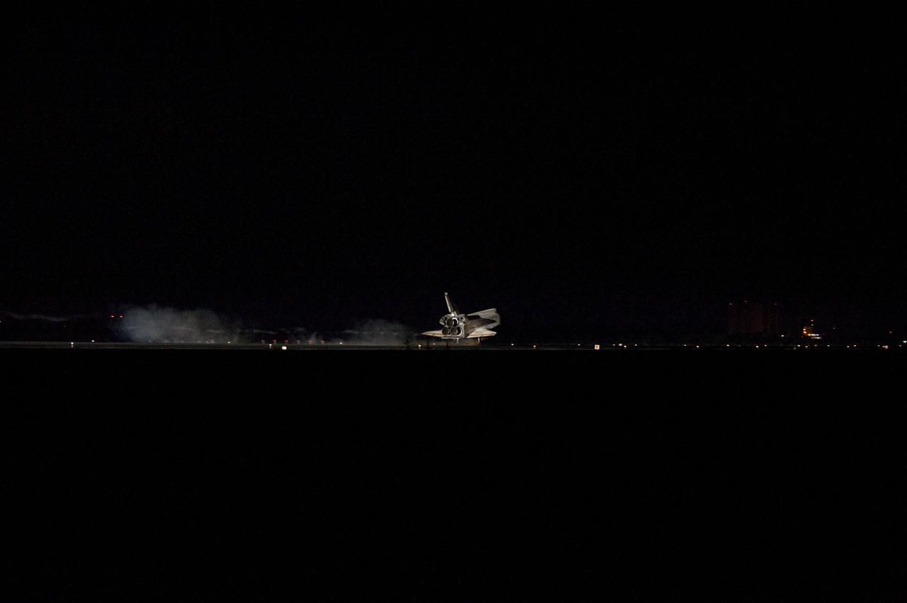 CAPE CANAVERAL, Fla. -- Space shuttle Atlantis' bright-white, iconic frame illuminates the darkness as it touches down on the Shuttle Landing Facility's Runway 15 at NASA's Kennedy Space Center in Florida for the final time. Securing the space shuttle fleet's place in history, Atlantis marked the 26th nighttime landing of NASA's Space Shuttle Program and the 78th landing at Kennedy. Main gear touchdown was at 5:57:00 a.m. EDT, followed by nose gear touchdown at 5:57:20 a.m., and wheelstop at 5:57:54 a.m. On board are STS-135 Commander Chris Ferguson, Pilot Doug Hurley, and Mission Specialists Sandra Magnus and Rex Walheim.              On the 37th shuttle mission to the International Space Station, STS-135 delivered more than 9,400 pounds of spare parts, equipment and supplies in the Raffaello multi-purpose logistics module that will sustain station operations for the next year. STS-135 was the 33rd and final flight for Atlantis, which has spent 307 days in space, orbited Earth 4,848 times and traveled 125,935,769 miles. For more information visit, www.nasa.gov/mission_pages/shuttle/shuttlemissions/sts135/index.html. Photo credit: NASA/Sandra Joseph