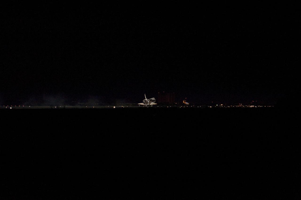 CAPE CANAVERAL, Fla. -- Space shuttle Atlantis' three main engines glow a red hue in the spacecraft's tail end as it touches down on the Shuttle Landing Facility's Runway 15 at NASA's Kennedy Space Center in Florida for the final time. Securing the space shuttle fleet's place in history, Atlantis marked the 26th nighttime landing of NASA's Space Shuttle Program and the 78th landing at Kennedy. Main gear touchdown was at 5:57:00 a.m. EDT, followed by nose gear touchdown at 5:57:20 a.m., and wheelstop at 5:57:54 a.m. On board are STS-135 Commander Chris Ferguson, Pilot Doug Hurley, and Mission Specialists Sandra Magnus and Rex Walheim. On the 37th shuttle mission to the International Space Station, STS-135 delivered more than 9,400 pounds of spare parts, equipment and supplies in the Raffaello multi-purpose logistics module that will sustain station operations for the next year. STS-135 was the 33rd and final flight for Atlantis, which has spent 307 days in space, orbited Earth 4,848 times and traveled 125,935,769 miles. For more information visit, www.nasa.gov/mission_pages/shuttle/shuttlemissions/sts135/index.html. Photo credit: NASA/Sandra Joseph