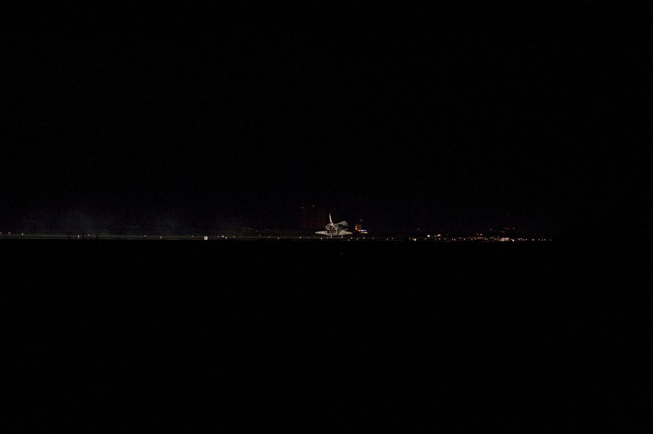 CAPE CANAVERAL, Fla. -- Space shuttle Atlantis' three main engines glow a red hue in the spacecraft's tail end as it touches down on the Shuttle Landing Facility's Runway 15 at NASA's Kennedy Space Center in Florida for the final time. Securing the space shuttle fleet's place in history, Atlantis marked the 26th nighttime landing of NASA's Space Shuttle Program and the 78th landing at Kennedy. Main gear touchdown was at 5:57:00 a.m. EDT, followed by nose gear touchdown at 5:57:20 a.m., and wheelstop at 5:57:54 a.m. On board are STS-135 Commander Chris Ferguson, Pilot Doug Hurley, and Mission Specialists Sandra Magnus and Rex Walheim. On the 37th shuttle mission to the International Space Station, STS-135 delivered more than 9,400 pounds of spare parts, equipment and supplies in the Raffaello multi-purpose logistics module that will sustain station operations for the next year. STS-135 was the 33rd and final flight for Atlantis, which has spent 307 days in space, orbited Earth 4,848 times and traveled 125,935,769 miles. For more information visit, www.nasa.gov/mission_pages/shuttle/shuttlemissions/sts135/index.html. Photo credit: NASA/Sandra Joseph