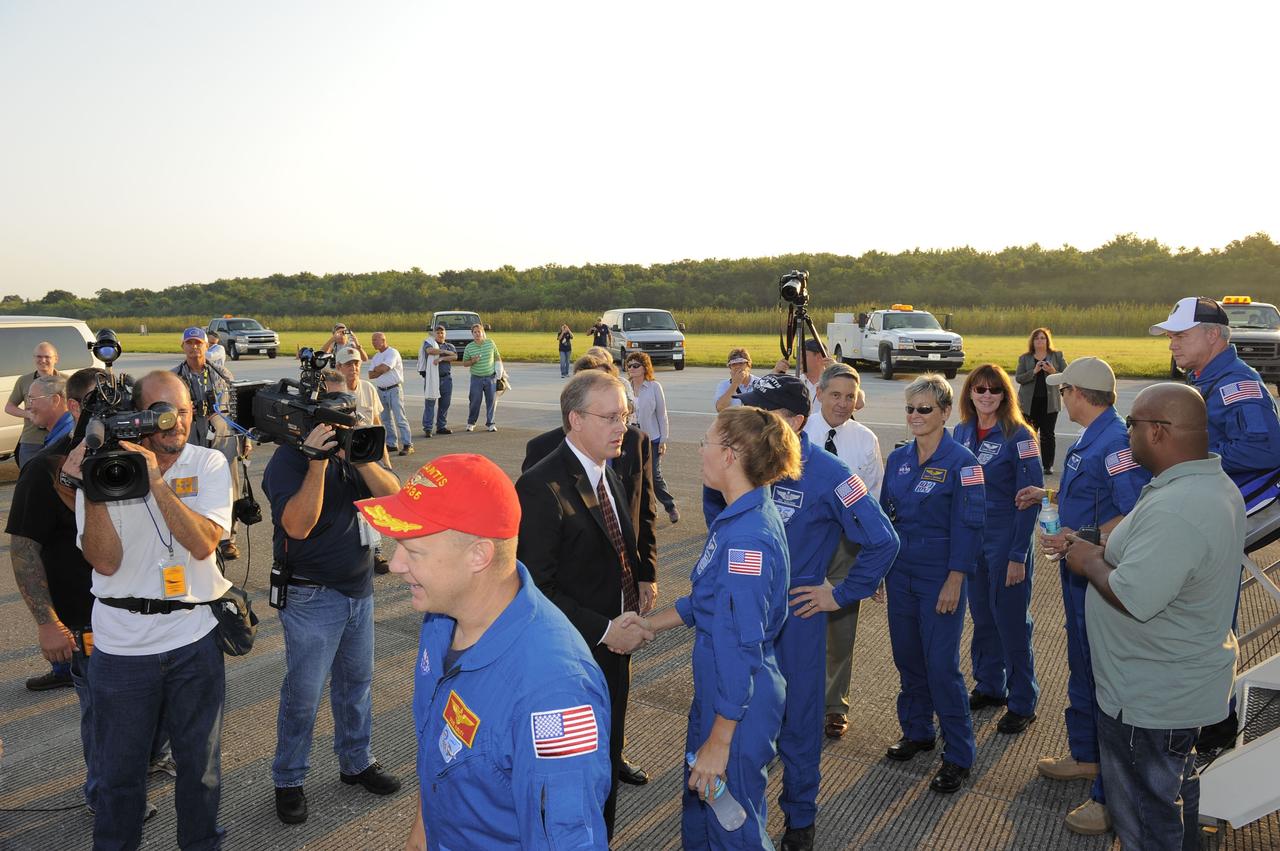 CAPE CANAVERAL, Fla. -- The STS-135 crew members are congratulated on their successful mission to the International Space Station. Four astronauts brought space shuttle Atlantis home to the Shuttle Landing Facility's Runway 15 at NASA's Kennedy Space Center in Florida at 5:57 a.m. EDT bringing a close NASA's Space Shuttle Program. Atlantis' final return from space completed a 13-day, 5.2-million-mile journey to the International Space Station.              STS-135 delivered spare parts, equipment and supplies in the Raffaello multi-purpose logistics module that will sustain station operations for the next year. STS-135 was the 33rd and final flight for Atlantis, which has spent 307 days in space, orbited Earth 4,848 times and traveled 125,935,769 miles. For more information visit, www.nasa.gov/mission_pages/shuttle/shuttlemissions/sts135/index.html. Photo credit: NASA/Kim Shiflett