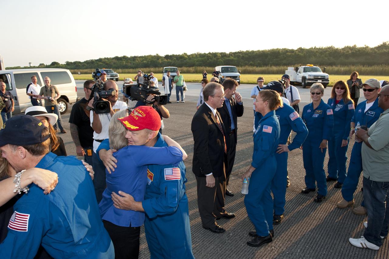 CAPE CANAVERAL, Fla. -- The STS-135 crew members are congratulated on their successful mission to the International Space Station. Four astronauts brought space shuttle Atlantis home to the Shuttle Landing Facility's Runway 15 at NASA's Kennedy Space Center in Florida at 5:57 a.m. EDT bringing a close NASA's Space Shuttle Program. Atlantis' final return from space completed a 13-day, 5.2-million-mile journey to the International Space Station.                STS-135 delivered spare parts, equipment and supplies in the Raffaello multi-purpose logistics module that will sustain station operations for the next year. STS-135 was the 33rd and final flight for Atlantis, which has spent 307 days in space, orbited Earth 4,848 times and traveled 125,935,769 miles. For more information visit, www.nasa.gov/mission_pages/shuttle/shuttlemissions/sts135/index.html. Photo credit: NASA/Kim Shiflett