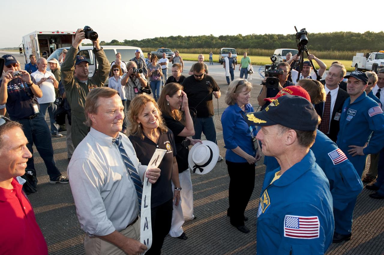CAPE CANAVERAL, Fla. -- The STS-135 crew members are congratulated on their successful mission to the International Space Station. Four astronauts brought space shuttle Atlantis home to the Shuttle Landing Facility's Runway 15 at NASA's Kennedy Space Center in Florida at 5:57 a.m. EDT bringing a close NASA's Space Shuttle Program. Atlantis' final return from space completed a 13-day, 5.2-million-mile journey to the International Space Station.                    STS-135 delivered spare parts, equipment and supplies in the Raffaello multi-purpose logistics module that will sustain station operations for the next year. STS-135 was the 33rd and final flight for Atlantis, which has spent 307 days in space, orbited Earth 4,848 times and traveled 125,935,769 miles. For more information visit, www.nasa.gov/mission_pages/shuttle/shuttlemissions/sts135/index.html. Photo credit: NASA/Kim Shiflett