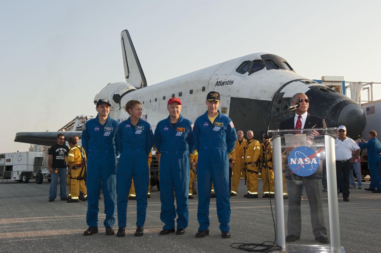CAPE CANAVERAL, Fla. -- NASA Administrator Charlie Bolden talks about bookending the space agency's Space Shuttle Program following the successful STS-135 mission to the International Space Station. The program's final four astronauts look on, from left: Mission Specialists Rex Walheim and Sandy Magnus, Pilot Doug Hurley, and Commander Chris Ferguson. The crew brought space shuttle Atlantis home to the Shuttle Landing Facility's Runway 15 at NASA's Kennedy Space Center in Florida at 5:57 a.m. EDT. Atlantis' final return from space completed a 13-day, 5.2-million-mile journey to the International Space Station.        STS-135 delivered spare parts, equipment and supplies in the Raffaello multi-purpose logistics module that will sustain station operations for the next year. STS-135 was the 33rd and final flight for Atlantis, which has spent 307 days in space, orbited Earth 4,848 times and traveled 125,935,769 miles. For more information visit, www.nasa.gov/mission_pages/shuttle/shuttlemissions/sts135/index.html. Photo credit: NASA/Kim Shiflett