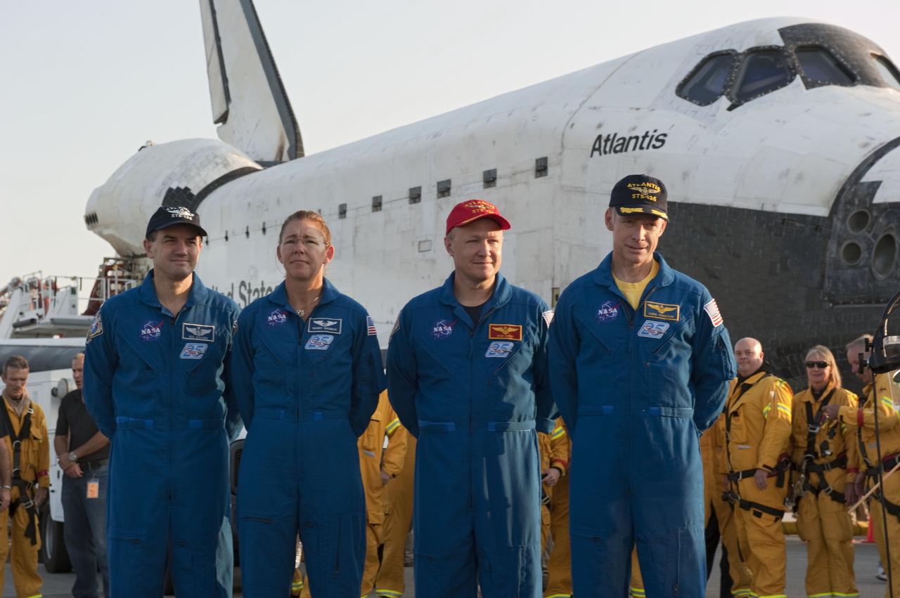 CAPE CANAVERAL, Fla. -- The final four astronauts of NASA's Space Shuttle Program stand proudly in front of space shuttle Atlantis, the remarkable spacecraft that took them on the STS-135 mission to the International Space Station. From left, are Mission Specialists Rex Walheim and Sandy Magnus, Pilot Doug Hurley, and Commander Chris Ferguson. The crew returned to Earth on the Shuttle Landing Facility's Runway 15 at NASA's Kennedy Space Center in Florida at 5:57 a.m. EDT. Atlantis' final return from space completed a 13-day, 5.2-million-mile journey to the International Space Station.          STS-135 delivered spare parts, equipment and supplies in the Raffaello multi-purpose logistics module that will sustain station operations for the next year. STS-135 was the 33rd and final flight for Atlantis, which has spent 307 days in space, orbited Earth 4,848 times and traveled 125,935,769 miles. For more information visit, www.nasa.gov/mission_pages/shuttle/shuttlemissions/sts135/index.html. Photo credit: NASA/Kim Shiflett