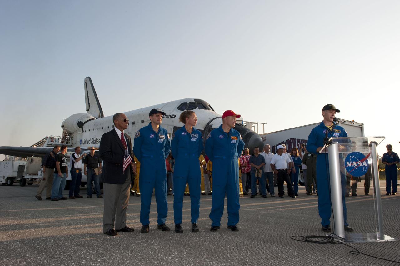 CAPE CANAVERAL, Fla. -- STS-135 Commander Chris Ferguson talks about bookending NASA's Space Shuttle Program following his successful mission to the International Space Station. Looking on, from left, are NASA Administrator Charlie Bolden, Mission Specialists Rex Walheim and Sandy Magnus, Pilot Doug Hurley, and Commander Chris Ferguson. The STS-135 crew brought space shuttle Atlantis home to the Shuttle Landing Facility's Runway 15 at NASA's Kennedy Space Center in Florida at 5:57 a.m. EDT. Atlantis' final return from space completed a 13-day, 5.2-million-mile journey to the International Space Station.      STS-135 delivered spare parts, equipment and supplies in the Raffaello multi-purpose logistics module that will sustain station operations for the next year. STS-135 was the 33rd and final flight for Atlantis, which has spent 307 days in space, orbited Earth 4,848 times and traveled 125,935,769 miles. For more information visit, www.nasa.gov/mission_pages/shuttle/shuttlemissions/sts135/index.html. Photo credit: NASA/Kim Shiflett