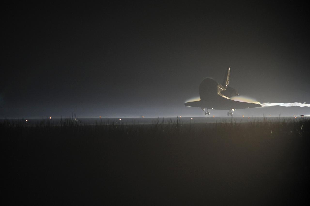 CAPE CANAVERAL, Fla. -- Xenon lights positioned on Runway 15 at the Shuttle Landing Facility reveal space shuttle Atlantis as it nears touchdown for the final time at NASA's Kennedy Space Center in Florida. Securing the space shuttle fleet's place in history, Atlantis marked the 26th nighttime landing of NASA's Space Shuttle Program and the 78th landing at Kennedy. Main gear touchdown was at 5:57:00 a.m. EDT, followed by nose gear touchdown at 5:57:20 a.m., and wheelstop at 5:57:54 a.m. On board are STS-135 Commander Chris Ferguson, Pilot Doug Hurley, and Mission Specialists Sandra Magnus and Rex Walheim.    On the 37th shuttle mission to the International Space Station, STS-135 delivered in the Raffaello multi-purpose logistics module    more than 9,400 pounds of spare parts, equipment and supplies that will sustain station operations for the next year. STS-135 was the 33rd and final flight for Atlantis, which has spent 307 days in space, orbited Earth 4,848 times and traveled 125,935,769 miles. STS-135 is the final mission in the Space Shuttle Program.  For more information, visit www.nasa.gov/mission_pages/shuttle/shuttlemissions/sts135/index.html. Photo credit: NASA/Chuck Tintera