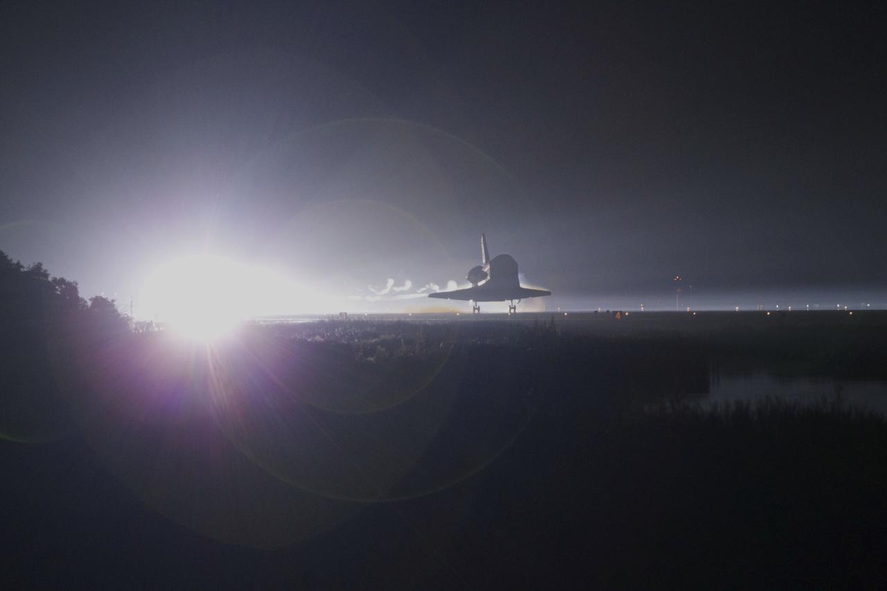 CAPE CANAVERAL, Fla. -- Xenon lights spotlight space shuttle Atlantis as the spacecraft nears touchdown for the last time on Runway 15 at NASA's Kennedy Space Center in Florida. Securing the space shuttle fleet's place in history, Atlantis marked the 26th nighttime landing of NASA's Space Shuttle Program and the 78th landing at Kennedy. Main gear touchdown was at 5:57:00 a.m. EDT, followed by nose gear touchdown at 5:57:20 a.m., and wheelstop at 5:57:54 a.m. On board are STS-135 Commander Chris Ferguson, Pilot Doug Hurley, and Mission Specialists Sandra Magnus and Rex Walheim.    On the 37th shuttle mission to the International Space Station, STS-135 delivered the Raffaello multi-purpose logistics module filled with more than 9,400 pounds of spare parts, equipment and supplies that will sustain station operations for the next year. STS-135 was the 33rd and final flight for Atlantis, which has spent 307 days in space, orbited Earth 4,848 times and traveled 125,935,769 miles. STS-135 also was the final mission of the Space Shuttle Program.  For more information, visit www.nasa.gov/mission_pages/shuttle/shuttlemissions/sts135/index.html. Photo credit: NASA/Kenny Allen