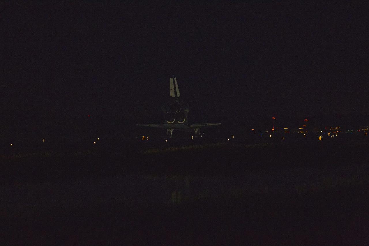 CAPE CANAVERAL, Fla. -- At the Shuttle Landing Facility at NASA's Kennedy Space Center in Florida, space shuttle Atlantis has returned home, landing on Runway 15 one final time.  Securing the space shuttle fleet's place in history, Atlantis marked the 26th nighttime landing of NASA's Space Shuttle Program and the 78th landing at Kennedy. Main gear touchdown was at 5:57:00 a.m. EDT, followed by nose gear touchdown at 5:57:20 a.m., and wheelstop at 5:57:54 a.m. On board are STS-135 Commander Chris Ferguson, Pilot Doug Hurley, and Mission Specialists Sandra Magnus and Rex Walheim.    On the 37th shuttle mission to the International Space Station, STS-135 delivered the Raffaello multi-purpose logistics module filled with more than 9,400 pounds of spare parts, equipment and supplies that will sustain station operations for the next year. STS-135 was the 33rd and final flight for Atlantis, which has spent 307 days in space, orbited Earth 4,848 times and traveled 125,935,769 miles. STS-135 also was the final mission of the Space Shuttle Program.  For more information, visit www.nasa.gov/mission_pages/shuttle/shuttlemissions/sts135/index.html. Photo credit: NASA/Kenny Allen