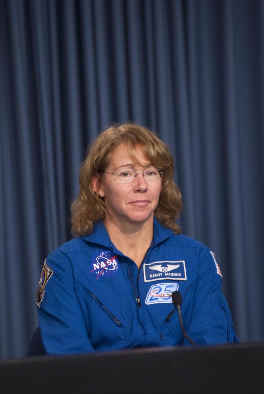 CAPE CANAVERAL, Fla. -- The crew of space shuttle Atlantis' STS-135 and final Space Shuttle Program Flight, participates in a news conference in the Press Site auditorium at NASA's Kennedy Space Center in Florida on landing day. Seen here is STS-135 Mission Specialist Sandy Magnus speaking to media.        Securing the space shuttle fleet's place in history, Atlantis marked the 26th nighttime landing of NASA's Space Shuttle Program and the 78th landing at Kennedy. Main gear touchdown was at 5:57:00 a.m. EDT, followed by nose gear touchdown at 5:57:20 a.m., and wheelstop at 5:57:54 a.m. Atlantis and its crew delivered to the International Space Station the Raffaello multi-purpose logistics module packed with  more than 9,400 pounds of spare parts, equipment and supplies that will sustain station operations for the next year. STS-135 was the 33rd and final flight for Atlantis, which has spent 307 days in space, orbited Earth 4,848 times and traveled 125,935,769 miles. For more information, visit www.nasa.gov/mission_pages/shuttle/shuttlemissions/sts135/index.html. Photo credit: NASA/Jim Grossmann