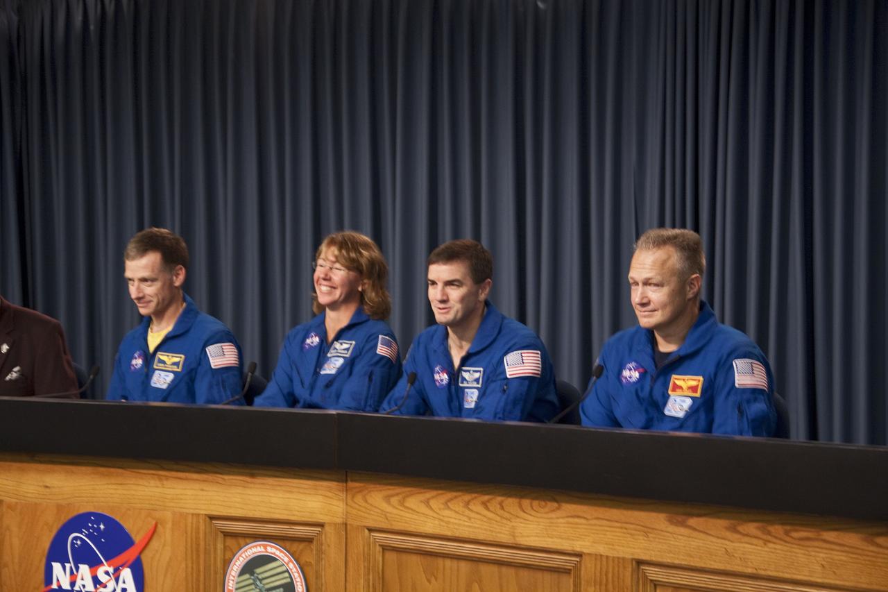CAPE CANAVERAL, Fla. -- The crew of space shuttle Atlantis' STS-135 and final Space Shuttle Program Flight, participates in a news conference in the Press Site auditorium at NASA's Kennedy Space Center in Florida on landing day. Seen here are STS-135 Commander Chris Ferguson (left), Mission Specialists Sandy Magnus and Rex Walheim and Pilot Doug Hurley. Securing the space shuttle fleet's place in history, Atlantis marked the 26th nighttime landing of NASA's Space Shuttle Program and the 78th landing at Kennedy. Main gear touchdown was at 5:57:00 a.m. EDT, followed by nose gear touchdown at 5:57:20 a.m., and wheelstop at 5:57:54 a.m. Atlantis and its crew delivered to the International Space Station the Raffaello multi-purpose logistics module packed with more than 9,400 pounds of spare parts, equipment and supplies that will sustain station operations for the next year. STS-135 was the 33rd and final flight for Atlantis, which has spent 307 days in space, orbited Earth 4,848 times and traveled 125,935,769 miles. For more information, visit www.nasa.gov/mission_pages/shuttle/shuttlemissions/sts135/index.html. Photo credit: NASA/Jim Grossmann
