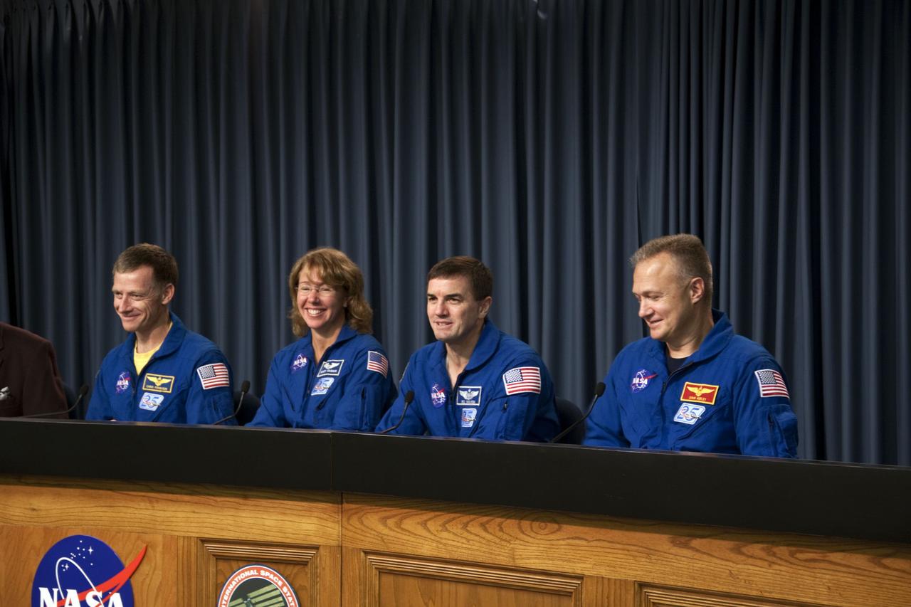 CAPE CANAVERAL, Fla. -- The crew of space shuttle Atlantis' STS-135 and final Space Shuttle Program Flight, participates in a news conference in the Press Site auditorium at NASA's Kennedy Space Center in Florida on landing day. Seen here are STS-135 Commander Chris Ferguson (left), Mission Specialists Sandy Magnus and Rex Walheim and Pilot Doug Hurley.  Securing the space shuttle fleet's place in history, Atlantis marked the 26th nighttime landing of NASA's Space Shuttle Program and the 78th landing at Kennedy. Main gear touchdown was at 5:57:00 a.m. EDT, followed by nose gear touchdown at 5:57:20 a.m., and wheelstop at 5:57:54 a.m. Atlantis and its crew delivered to the International Space Station the Raffaello multi-purpose logistics module packed with  more than 9,400 pounds of spare parts, equipment and supplies that will sustain station operations for the next year. STS-135 was the 33rd and final flight for Atlantis, which has spent 307 days in space, orbited Earth 4,848 times and traveled 125,935,769 miles. For more information, visit www.nasa.gov/mission_pages/shuttle/shuttlemissions/sts135/index.html. Photo credit: NASA/Jim Grossmann