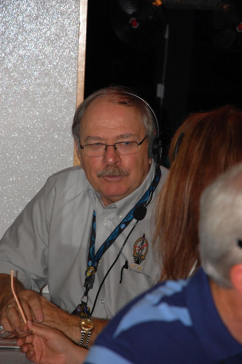 CAPE CANAVERAL, Fla. -- The Convoy Command Center vehicle is positioned on the Shuttle Landing Facility (SLF) at NASA's Kennedy Space Center in Florida awaiting the landing of space shuttle Atlantis. The command vehicle is equipped to control critical communications between the crew still aboard Atlantis and the Launch Control Center. The team will monitor the health of the orbiter systems and direct convoy operations made up of about 40 vehicles, including 25 specially designed vehicles to assist the crew in leaving the shuttle, and prepare the vehicle for towing from the SLF to its processing hangar. Seen here is Dean Schaaf with the Convoy Command Center.    Securing the space shuttle fleet's place in history, Atlantis marks the 26th nighttime landing of NASA's Space Shuttle Program and the 78th landing at Kennedy. Atlantis and its crew delivered to the International Space Station the Raffaello multi-purpose logistics module packed with more than 9,400 pounds of spare parts, equipment and supplies that will sustain station operations for the next year. STS-135 is the 33rd and final flight for Atlantis and the final mission of the Space Shuttle Program. For more information, visit www.nasa.gov/mission_pages/shuttle/shuttlemissions/sts135/index.html. Photo credit: NASA/Ben Smegelsky