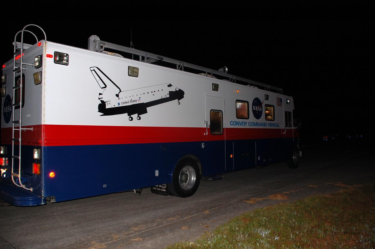 CAPE CANAVERAL, Fla. -- The Convoy Command Center vehicle is positioned on the Shuttle Landing Facility (SLF) at NASA's Kennedy Space Center in Florida awaiting the landing of space shuttle Atlantis. The command vehicle is equipped to control critical communications between the crew still aboard Atlantis and the Launch Control Center. The team will monitor the health of the orbiter systems and direct convoy operations made up of about 40 vehicles, including 25 specially designed vehicles to assist the crew in leaving the shuttle, and prepare the vehicle for towing from the SLF to its processing hangar.         Securing the space shuttle fleet's place in history, Atlantis marks the 26th nighttime landing of NASA's Space Shuttle Program and the 78th landing at Kennedy. Atlantis and its crew delivered to the International Space Station the Raffaello multi-purpose logistics module packed with more than 9,400 pounds of spare parts, equipment and supplies that will sustain station operations for the next year. STS-135 is the 33rd and final flight for Atlantis and the final mission of the Space Shuttle Program. For more information, visit www.nasa.gov/mission_pages/shuttle/shuttlemissions/sts135/index.html. Photo credit: NASA/Ben Smegelsky