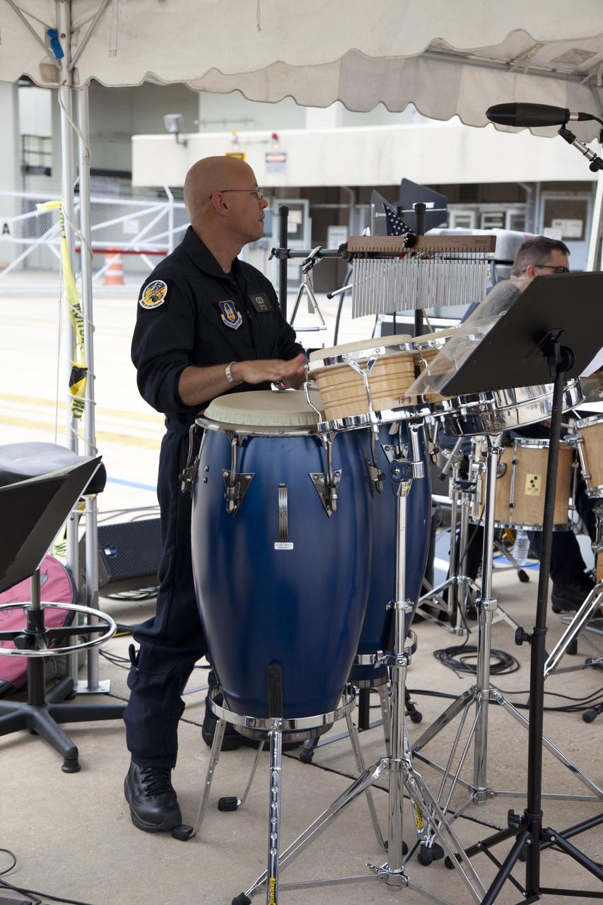 CAPE CANAVERAL, Fla. -- At NASA's Kennedy Space Center in Florida, The Band of the United States Air Force Reserve provides entertainment at an employee appreciation event for the thousands of workers who have processed, launched and landed America's space shuttles for more than three decades. Following the successful STS-135 mission, space shuttle Atlantis was parked at the celebration site for photo opportunities. STS-135 secured the space shuttle fleet's place in history and brought a close to NASA's Space Shuttle Program.                            STS-135 delivered spare parts, equipment and supplies to the International Space Station. STS-135 was the 33rd and final flight for Atlantis, which has spent 307 days in space, orbited Earth 4,848 times and traveled 125,935,769 miles. For more information visit, www.nasa.gov/mission_pages/shuttle/shuttlemissions/sts135/index.html. Photo credit: NASA/Frankie Martin