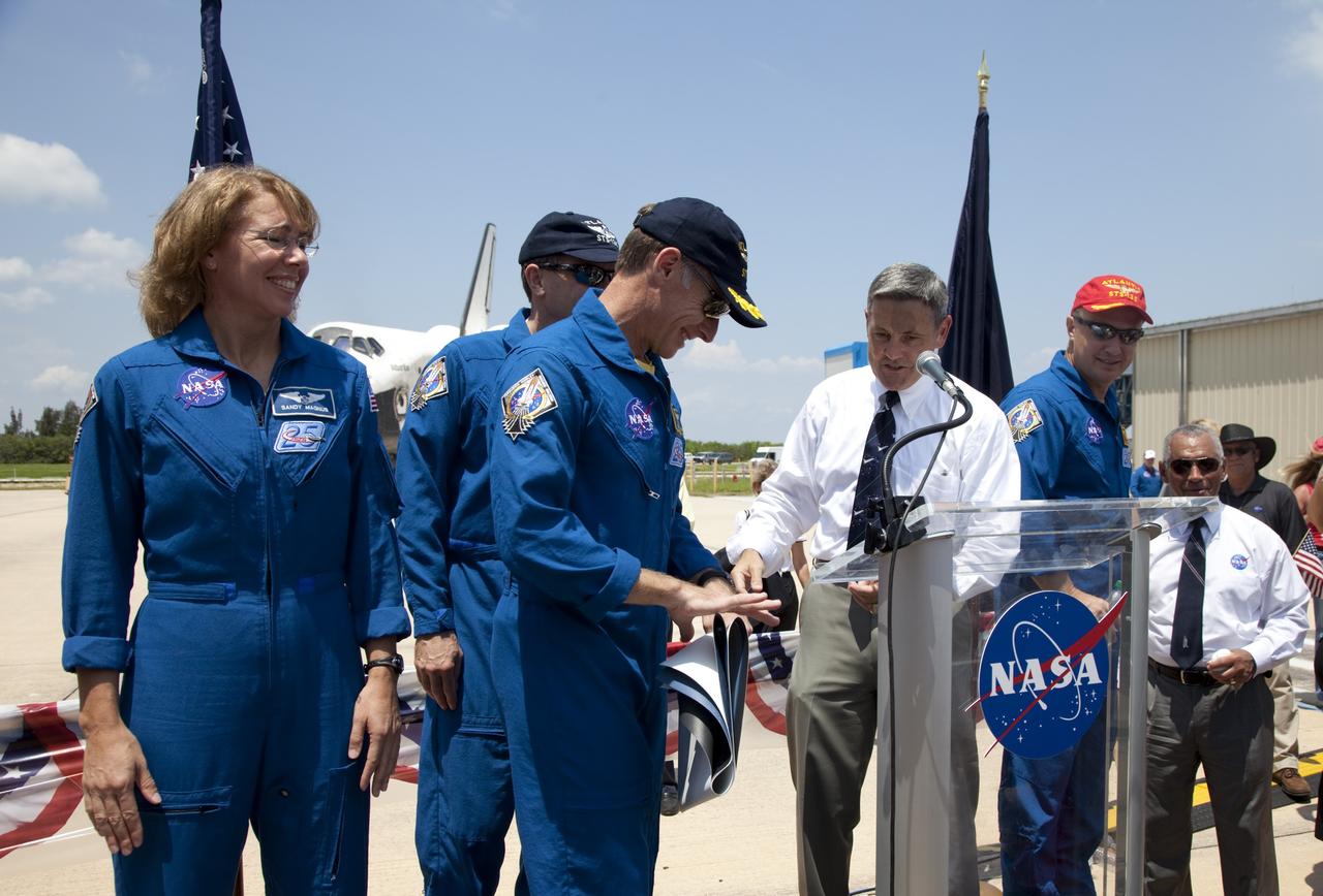 CAPE CANAVERAL, Fla. -- The STS-135 crew members and NASA Kennedy Space Center Director Bob Cabana express their gratitude to the thousands of workers who have processed, launched and landed the space shuttles for more than three decades during an employee appreciation event. Space shuttle Atlantis' final return from space at 5:57 a.m. EDT secured the space shuttle fleet's place in history and brought a close to the STS-135 mission and America's Space Shuttle Program.                              STS-135 delivered spare parts, equipment and supplies to the International Space Station. STS-135 was the 33rd and final flight for Atlantis, which has spent 307 days in space, orbited Earth 4,848 times and traveled 125,935,769 miles. For more information visit, www.nasa.gov/mission_pages/shuttle/shuttlemissions/sts135/index.html. Photo credit: NASA/Frankie Martin