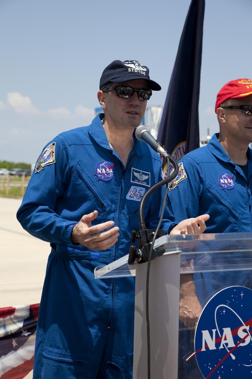 CAPE CANAVERAL, Fla. -- STS-135 Mission Specialist Rex Walheim expresses his gratitude to the thousands of workers who have processed, launched and landed the space shuttles for more than three decades during an employee appreciation event. On the right is Pilot Doug Hurley. Space shuttle Atlantis' final return from space at 5:57 a.m. EDT secured the space shuttle fleet's place in history and brought a close to the STS-135 mission and America's Space Shuttle Program.                          STS-135 delivered spare parts, equipment and supplies to the International Space Station. STS-135 was the 33rd and final flight for Atlantis, which has spent 307 days in space, orbited Earth 4,848 times and traveled 125,935,769 miles. For more information visit, www.nasa.gov/mission_pages/shuttle/shuttlemissions/sts135/index.html. Photo credit: NASA/Frankie Martin