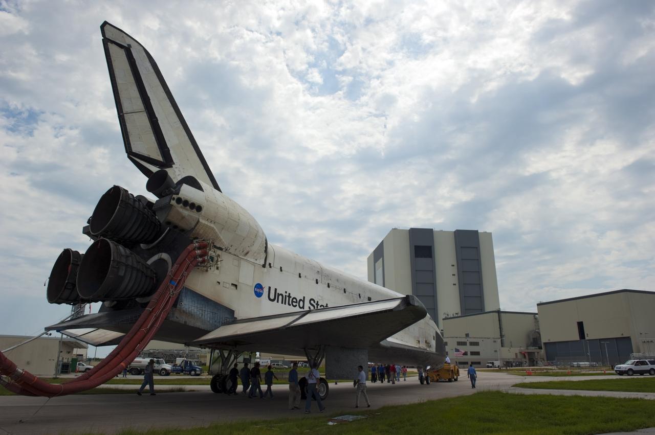 CAPE CANAVERAL, Fla. -- Space shuttle Atlantis is slowly towed from the Shuttle Landing Facility runway to Orbiter Processing Facility-2 for the last time. Atlantis' final return to Earth on Runway 15 at NASA's Kennedy Space Center in Florida occurred at 5:57 a.m. EDT July 21, 2011.                  Securing the space shuttle fleet's place in history, Atlantis marks the 26th nighttime landing of NASA's Space Shuttle Program and the 78th landing at Kennedy. Atlantis and its crew delivered to the International Space Station the Raffaello multi-purpose logistics module packed with more than 9,400 pounds of spare parts, equipment and supplies that will sustain station operations for the next year. STS-135 is the 33rd and final flight for Atlantis and the final mission of the Space Shuttle Program. For more information, visit www.nasa.gov/mission_pages/shuttle/shuttlemissions/sts135/index.html. Photo credit: NASA/Kim Shiflett