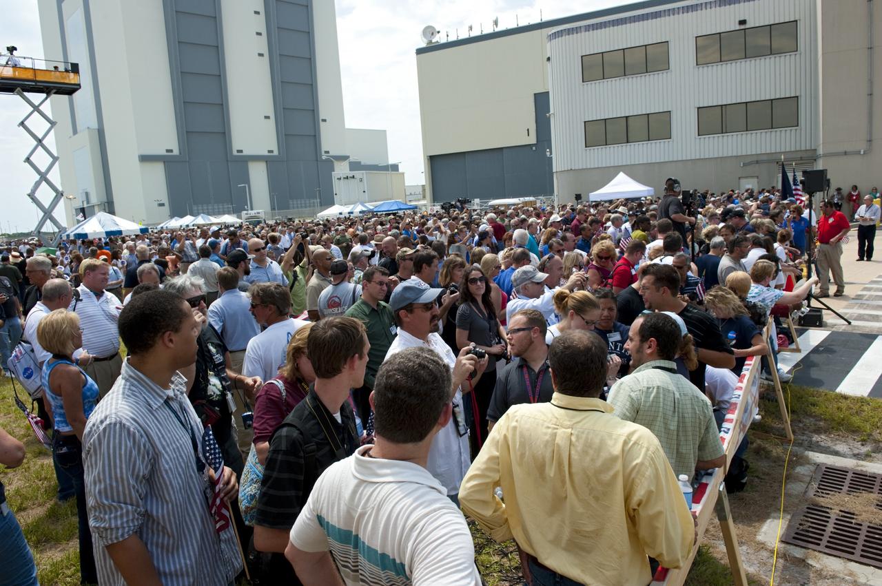 CAPE CANAVERAL, Fla. -- Thousands of workers who have processed, launched and landed space shuttles for more than three decades, gather for an employee appreciation event in front of Orbiter Processing Facility-2 at NASA's Kennedy Space Center in Florida. Atlantis' final return to Earth occurred at 5:57 a.m. EDT July 21, 2011.                     Securing the space shuttle fleet's place in history, Atlantis marks the 26th nighttime landing of NASA's Space Shuttle Program and the 78th landing at Kennedy. Atlantis and its crew delivered to the International Space Station the Raffaello multi-purpose logistics module packed with more than 9,400 pounds of spare parts, equipment and supplies that will sustain station operations for the next year. STS-135 is the 33rd and final flight for Atlantis and the final mission of the Space Shuttle Program. For more information, visit www.nasa.gov/mission_pages/shuttle/shuttlemissions/sts135/index.html. Photo credit: NASA/Kim Shiflett