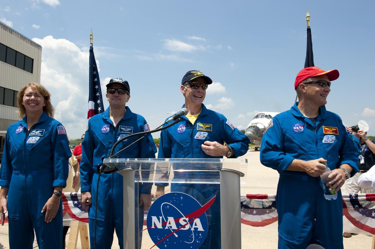 CAPE CANAVERAL, Fla. -- The STS-135 crew members express their gratitude to the thousands of workers who have processed, launched and landed the space shuttles for more than three decades during an employee appreciation event held in front of Orbiter Processing Facility-2 at NASA's Kennedy Space Center in Florida. Seen here are Mission Specialists Sandy Magnus and Rex Walheim, Commander Chris Ferguson and Pilot Doug Hurley. Atlantis' final return to Earth occurred at 5:57 a.m. EDT July 21, 2011.                      Securing the space shuttle fleet's place in history, Atlantis marks the 26th nighttime landing of NASA's Space Shuttle Program and the 78th landing at Kennedy. Atlantis and its crew delivered to the International Space Station the Raffaello multi-purpose logistics module packed with more than 9,400 pounds of spare parts, equipment and supplies that will sustain station operations for the next year. STS-135 is the 33rd and final flight for Atlantis and the final mission of the Space Shuttle Program. For more information, visit www.nasa.gov/mission_pages/shuttle/shuttlemissions/sts135/index.html. Photo credit: NASA/Kim Shiflett