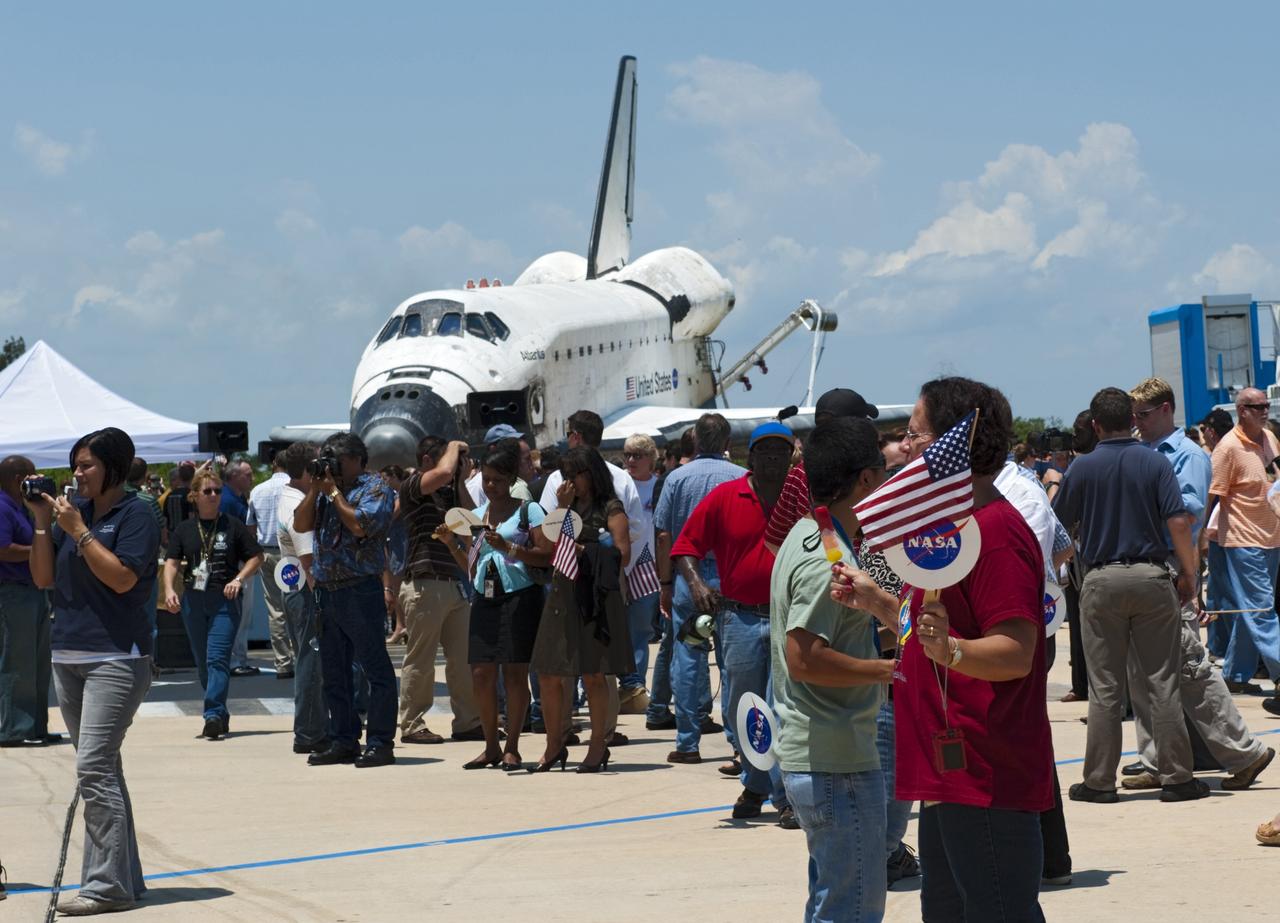 CAPE CANAVERAL, Fla. -- Thousands of workers who have processed, launched and landed space shuttles for more than three decades, gather in front of space shuttle Atlantis after an employee appreciation event at Orbiter Processing Facility-2 at NASA's Kennedy Space Center in Florida. Atlantis' final return to Earth occurred at 5:57 a.m. EDT July 21, 2011.                               Securing the space shuttle fleet's place in history, Atlantis marks the 26th nighttime landing of NASA's Space Shuttle Program and the 78th landing at Kennedy. Atlantis and its crew delivered to the International Space Station the Raffaello multi-purpose logistics module packed with more than 9,400 pounds of spare parts, equipment and supplies that will sustain station operations for the next year. STS-135 is the 33rd and final flight for Atlantis and the final mission of the Space Shuttle Program. For more information, visit www.nasa.gov/mission_pages/shuttle/shuttlemissions/sts135/index.html. Photo credit: NASA/Kim Shiflett