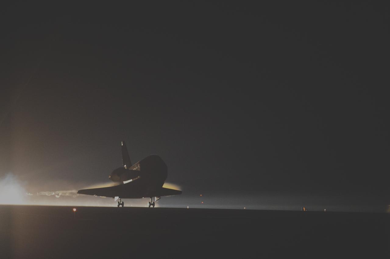 CAPE CANAVERAL, Fla. -- Backlit by the xenon lights on Runway 15 at the Shuttle Landing Facility, space shuttle Atlantis nears touchdown for the final time at NASA's Kennedy Space Center in Florida.  Securing the space shuttle fleet's place in history, Atlantis marked the 26th nighttime landing of NASA's Space Shuttle Program and the 78th landing at Kennedy. Main gear touchdown was at 5:57:00 a.m. EDT, followed by nose gear touchdown at 5:57:20 a.m., and wheelstop at 5:57:54 a.m. On board are STS-135 Commander Chris Ferguson, Pilot Doug Hurley, and Mission Specialists Sandra Magnus and Rex Walheim.    On the 37th shuttle mission to the International Space Station, STS-135 delivered the Raffaello multi-purpose logistics module filled with more than 9,400 pounds of spare parts, equipment and supplies that will sustain station operations for the next year. STS-135 was the 33rd and final flight for Atlantis, which has spent 307 days in space, orbited Earth 4,848 times and traveled 125,935,769 miles. It was the final mission of the Space Shuttle Program.  For more information, visit www.nasa.gov/mission_pages/shuttle/shuttlemissions/sts135/index.html. Photo credit: NASA/Sandra Joseph and Kevin O'Connell
