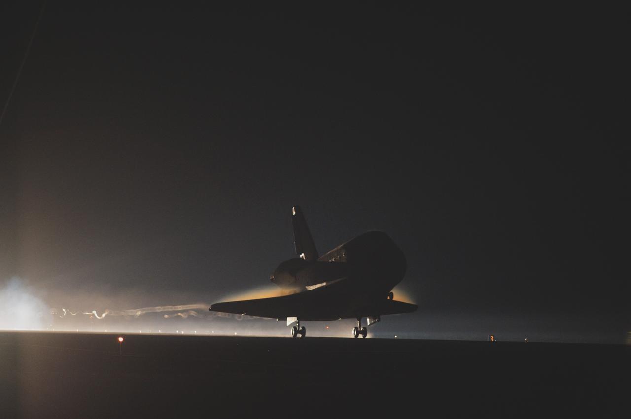 CAPE CANAVERAL, Fla. -- Trailing ribbons of steam and smoke, space shuttle Atlantis touches down for the final time on the Shuttle Landing Facility's Runway 15 at NASA's Kennedy Space Center in Florida. Securing the space shuttle fleet's place in history, Atlantis marked the 26th nighttime landing of NASA's Space Shuttle Program and the 78th landing at Kennedy. Main gear touchdown was at 5:57:00 a.m. EDT, followed by nose gear touchdown at 5:57:20 a.m., and wheelstop at 5:57:54 a.m. On board are STS-135 Commander Chris Ferguson, Pilot Doug Hurley, and Mission Specialists Sandra Magnus and Rex Walheim.    On the 37th shuttle mission to the International Space Station, STS-135 delivered the Raffaello multi-purpose logistics module filled with more than 9,400 pounds of spare parts, equipment and supplies that will sustain station operations for the next year. STS-135 was the 33rd and final flight for Atlantis, which has spent 307 days in space, orbited Earth 4,848 times and traveled 125,935,769 miles. It was the final mission of the Space Shuttle Program.  For more information, visit www.nasa.gov/mission_pages/shuttle/shuttlemissions/sts135/index.html. Photo credit: NASA/Sandra Joseph and Kevin O'Connell