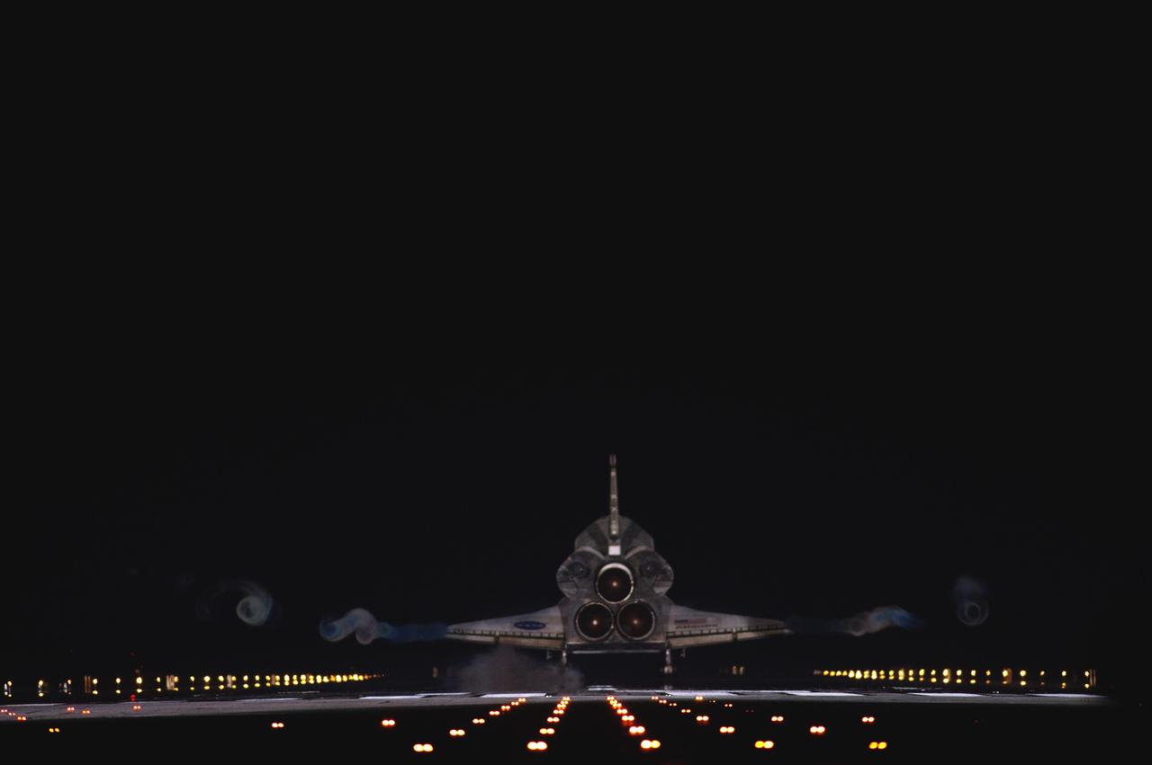CAPE CANAVERAL, Fla. -- Vapor trails follow space shuttle Atlantis as it touches down on Runway 15 on the Shuttle Landing Facility at NASA's Kennedy Space Center in Florida for the final time. A vapor trail, known as a contrail, is a cloud of water vapor that condenses and freezes around the small particles in aircraft exhaust. Atlantis marked the 26th nighttime landing of NASA's Space Shuttle Program and the 78th landing at Kennedy. It also was the final mission for the shuttle program.      STS-135 was the 33rd and final flight for Atlantis, which has spent 307 days in space, orbited Earth 4,848 times and traveled 125,935,769 miles. For more information on the space shuttle era, visit www.nasa.gov/mission_pages/shuttle/flyout. Photo credit: NASA/Sandra Joseph and Kevin O'Connell