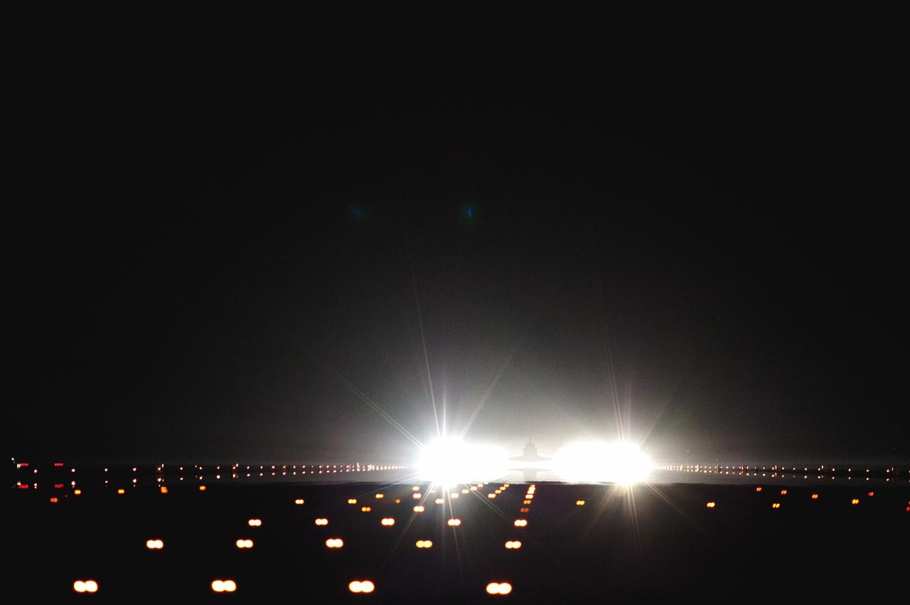 CAPE CANAVERAL, Fla. -- Xenon lights positioned at the end of Runway 15 spotlight space shuttle Atlantis as it nears touchdown for the last time at NASA's Kennedy Space Center in Florida. Securing the space shuttle fleet's place in history, Atlantis marked the 26th nighttime landing of NASA's Space Shuttle Program and the 78th landing at Kennedy. Main gear touchdown was at 5:57:00 a.m. EDT, followed by nose gear touchdown at 5:57:20 a.m., and wheelstop at 5:57:54 a.m. On board are STS-135 Commander Chris Ferguson, Pilot Doug Hurley, and Mission Specialists Sandy Magnus and Rex Walheim.    On the 37th shuttle mission to the International Space Station, STS-135 delivered the Raffaello multi-purpose logistics module filled with more than 9,400 pounds of spare parts, equipment and supplies that will sustain station operations for the next year. STS-135 was the 33rd and final flight for Atlantis, which has spent 307 days in space, orbited Earth 4,848 times and traveled 125,935,769 miles. STS-135 also was the final mission of the Space Shuttle Program.  For more information, visit www.nasa.gov/mission_pages/shuttle/shuttlemissions/sts135/index.html. Photo credit: NASA/Tom Farrar and Tony Gray