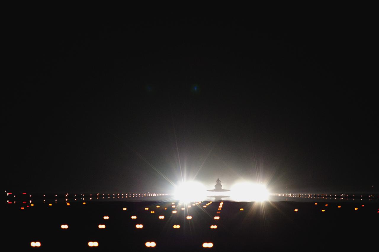 CAPE CANAVERAL, Fla. -- At NASA's Kennedy Space Center in Florida, xenon lights positioned at the end of Runway 15 illuminate the Shuttle Landing Facility for space shuttle Atlantis' final return from space. Securing the space shuttle fleet's place in history, Atlantis marked the 26th nighttime landing of NASA's Space Shuttle Program and the 78th landing at Kennedy. Main gear touchdown was at 5:57:00 a.m. EDT, followed by nose gear touchdown at 5:57:20 a.m., and wheelstop at 5:57:54 a.m. On board are STS-135 Commander Chris Ferguson, Pilot Doug Hurley, and Mission Specialists Sandy Magnus and Rex Walheim.    On the 37th shuttle mission to the International Space Station, STS-135 delivered the Raffaello multi-purpose logistics module filled with more than 9,400 pounds of spare parts, equipment and supplies that will sustain station operations for the next year. STS-135 was the 33rd and final flight for Atlantis, which has spent 307 days in space, orbited Earth 4,848 times and traveled 125,935,769 miles. STS-135 also was the final mission of the Space Shuttle Program.  For more information, visit www.nasa.gov/mission_pages/shuttle/shuttlemissions/sts135/index.html. Photo credit: NASA/Tom Farrar and Tony Gray
