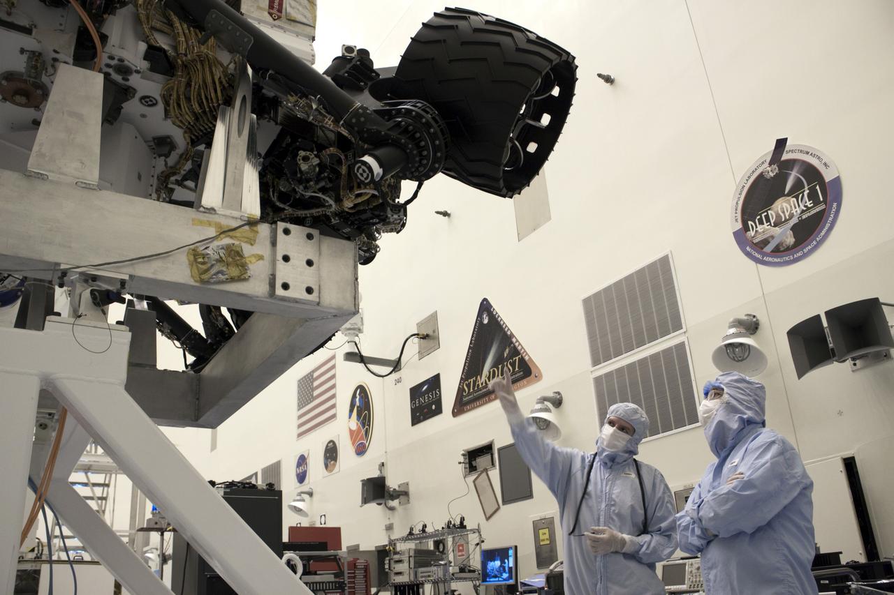 Cape Canaveral, Fla. -- At the Payload Hazardous Servicing Facility at NASA's Kennedy Space Center in Florida, Dr. Charles Elachi, Director of Advanced Planning at NASA's Jet Propulsion Laboratory (right), is shown NASA's Mars Science Laboratory (MSL) rover known as Curiosity. A United Launch Alliance Atlas V-541 configuration will be used to loft MSL into space. Curiosity’s 10 science instruments are designed to search for evidence on whether Mars has had environments favorable to microbial life, including chemical ingredients for life. The unique rover will use a laser to look inside rocks and release its gasses so that the rover’s spectrometer can analyze and send the data back to Earth. MSL is scheduled to launch from Cape Canaveral Air Force Station in Florida Nov. 25 with a window extending to Dec. 18 and arrival at Mars Aug. 2012. For more information, visit http://www.nasa.gov/msl. Photo credit: NASA/Jim Grossmann