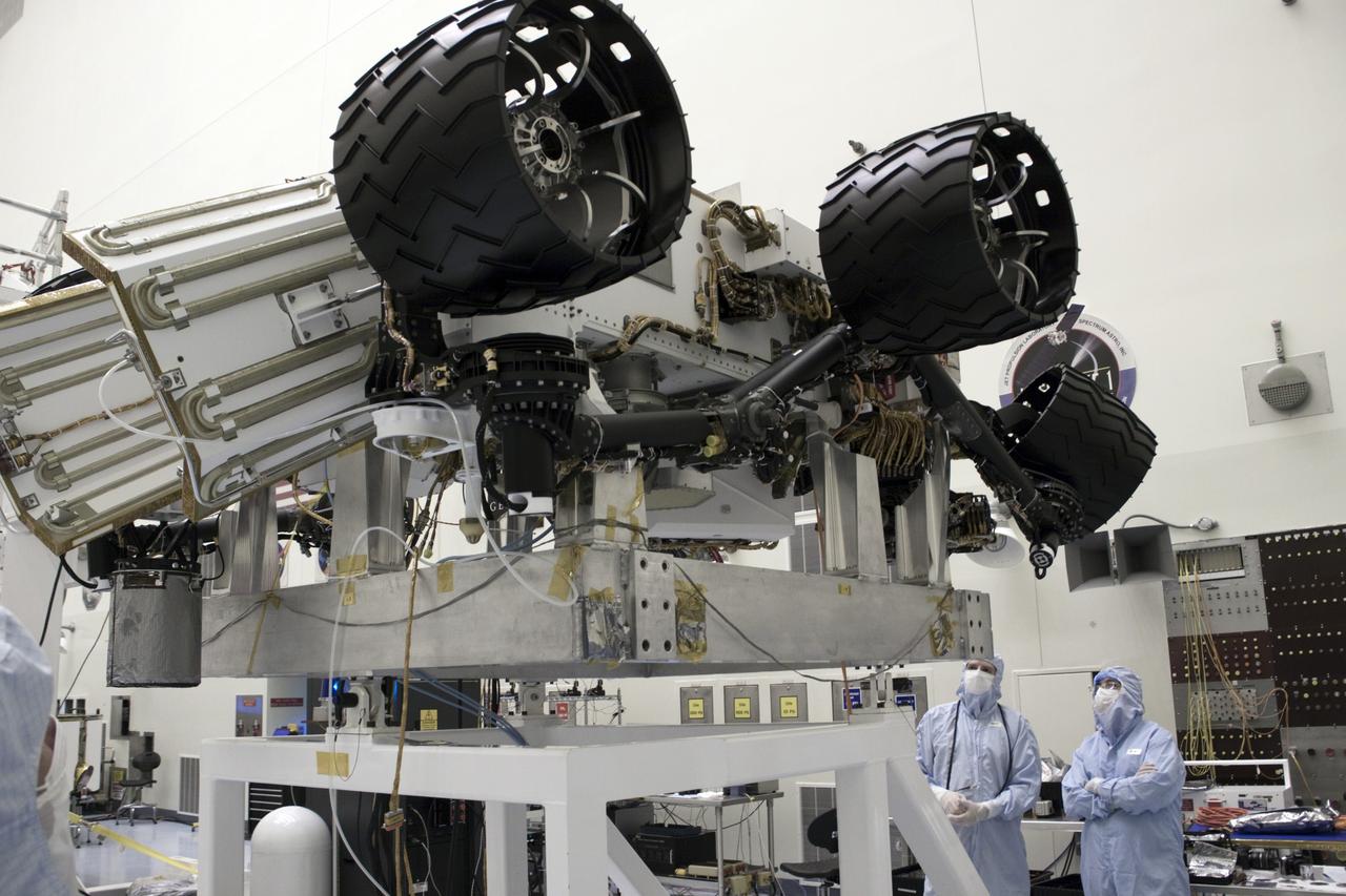 Cape Canaveral, Fla. -- At the Payload Hazardous Servicing Facility at NASA's Kennedy Space Center in Florida, Dr. Charles Elachi, Director of Advanced Planning at NASA's Jet Propulsion Laboratory (right), is shown NASA's Mars Science Laboratory (MSL) rover known as Curiosity. A United Launch Alliance Atlas V-541 configuration will be used to loft MSL into space. Curiosity’s 10 science instruments are designed to search for evidence on whether Mars has had environments favorable to microbial life, including chemical ingredients for life. The unique rover will use a laser to look inside rocks and release its gasses so that the rover’s spectrometer can analyze and send the data back to Earth. MSL is scheduled to launch from Cape Canaveral Air Force Station in Florida Nov. 25 with a window extending to Dec. 18 and arrival at Mars Aug. 2012. For more information, visit http://www.nasa.gov/msl. Photo credit: NASA/Jim Grossmann