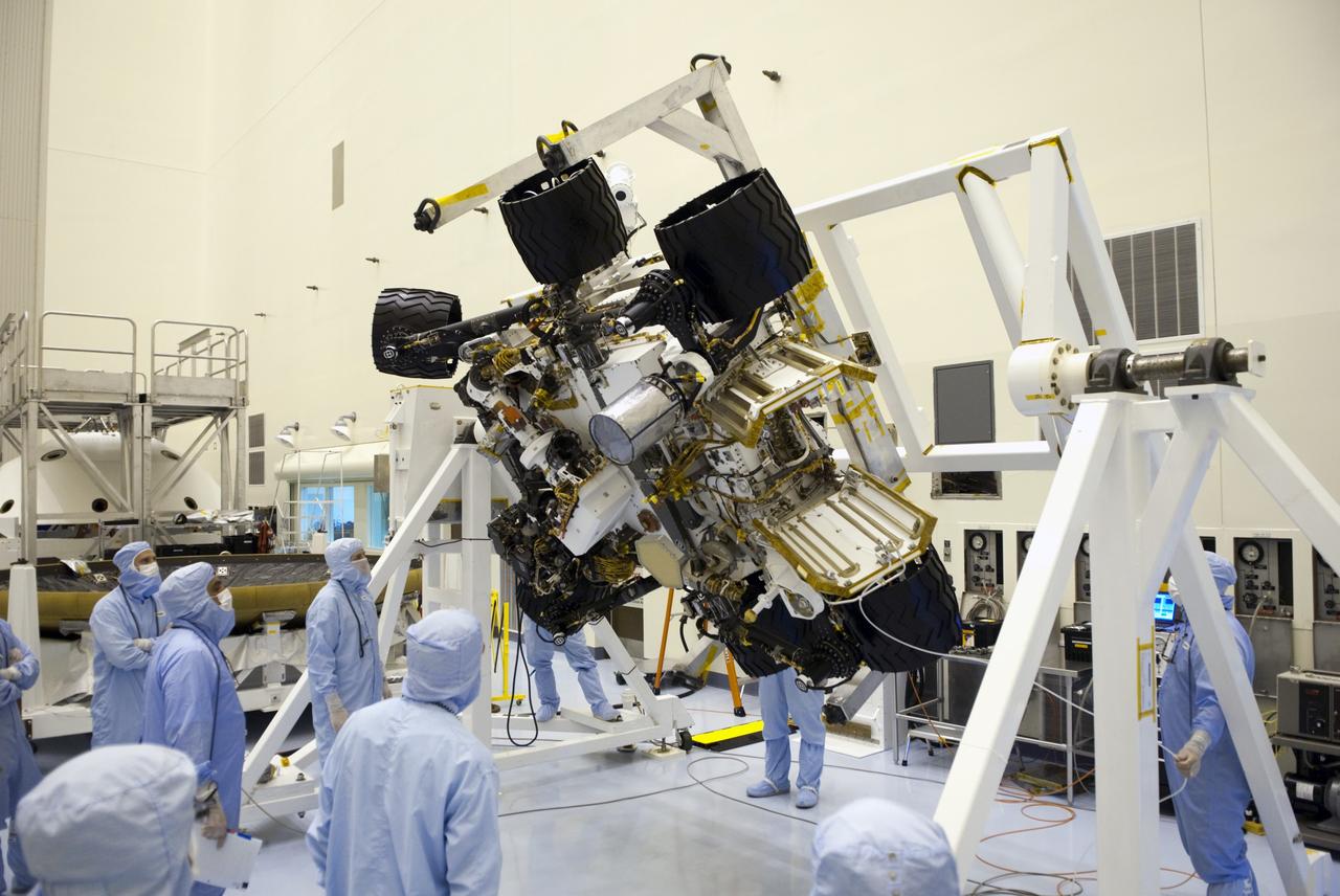 CAPE CANAVERAL, Fla. -- Technicians in the Payload Hazardous Servicing Facility at NASA's Kennedy Space Center in Florida put NASA's Mars Science Laboratory (MSL) rover, known as Curiosity, through a series of rotation tests. A United Launch Alliance Atlas V-541 configuration will be used to loft MSL into space. Curiosity’s 10 science instruments are designed to search for evidence on whether Mars has had environments favorable to microbial life, including chemical ingredients for life. The unique rover will use a laser to look inside rocks and release its gasses so that the rover’s spectrometer can analyze and send the data back to Earth. MSL is scheduled to launch from Cape Canaveral Air Force Station in Florida Nov. 25 with a window extending to Dec. 18 and arrival at Mars Aug. 2012. For more information, visit http://www.nasa.gov/msl. Photo credit: NASA/Jim Grossmann