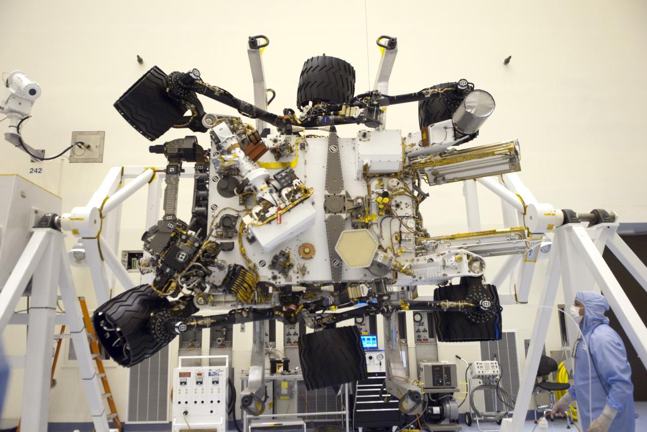 CAPE CANAVERAL, Fla. -- Technicians in the Payload Hazardous Servicing Facility at NASA's Kennedy Space Center in Florida put NASA's Mars Science Laboratory (MSL) rover, known as Curiosity, through a series of rotation tests. A United Launch Alliance Atlas V-541 configuration will be used to loft MSL into space. Curiosity’s 10 science instruments are designed to search for evidence on whether Mars has had environments favorable to microbial life, including chemical ingredients for life. The unique rover will use a laser to look inside rocks and release its gasses so that the rover’s spectrometer can analyze and send the data back to Earth. MSL is scheduled to launch from Cape Canaveral Air Force Station in Florida Nov. 25 with a window extending to Dec. 18 and arrival at Mars Aug. 2012. For more information, visit http://www.nasa.gov/msl. Photo credit: NASA/Jim Grossmann