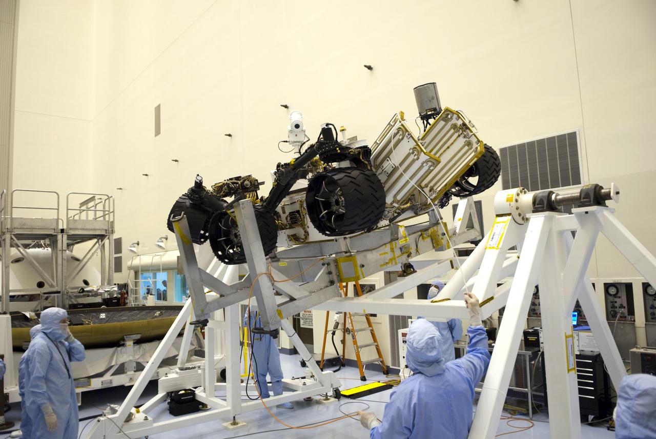 CAPE CANAVERAL, Fla. -- Technicians in the Payload Hazardous Servicing Facility at NASA's Kennedy Space Center in Florida put NASA's Mars Science Laboratory (MSL) rover, known as Curiosity, through a series of rotation tests. A United Launch Alliance Atlas V-541 configuration will be used to loft MSL into space. Curiosity’s 10 science instruments are designed to search for evidence on whether Mars has had environments favorable to microbial life, including chemical ingredients for life. The unique rover will use a laser to look inside rocks and release its gasses so that the rover’s spectrometer can analyze and send the data back to Earth. MSL is scheduled to launch from Cape Canaveral Air Force Station in Florida Nov. 25 with a window extending to Dec. 18 and arrival at Mars Aug. 2012. For more information, visit http://www.nasa.gov/msl. Photo credit: NASA/Jim Grossmann