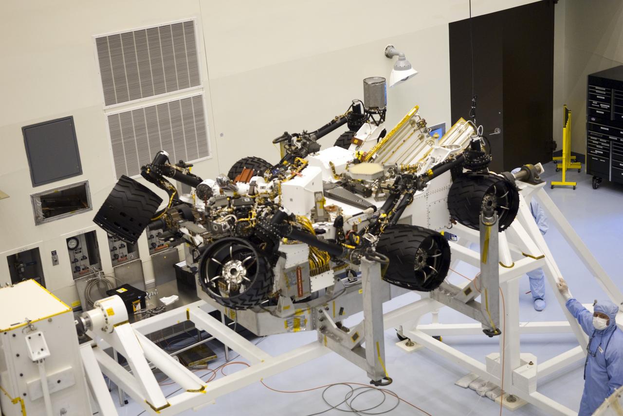 CAPE CANAVERAL, Fla. -- Technicians in the Payload Hazardous Servicing Facility at NASA's Kennedy Space Center in Florida put NASA's Mars Science Laboratory (MSL) rover, known as Curiosity, through a series of rotation tests. A United Launch Alliance Atlas V-541 configuration will be used to loft MSL into space. Curiosity’s 10 science instruments are designed to search for evidence on whether Mars has had environments favorable to microbial life, including chemical ingredients for life. The unique rover will use a laser to look inside rocks and release its gasses so that the rover’s spectrometer can analyze and send the data back to Earth. MSL is scheduled to launch from Cape Canaveral Air Force Station in Florida Nov. 25 with a window extending to Dec. 18 and arrival at Mars Aug. 2012. For more information, visit http://www.nasa.gov/msl. Photo credit: NASA/Jim Grossmann