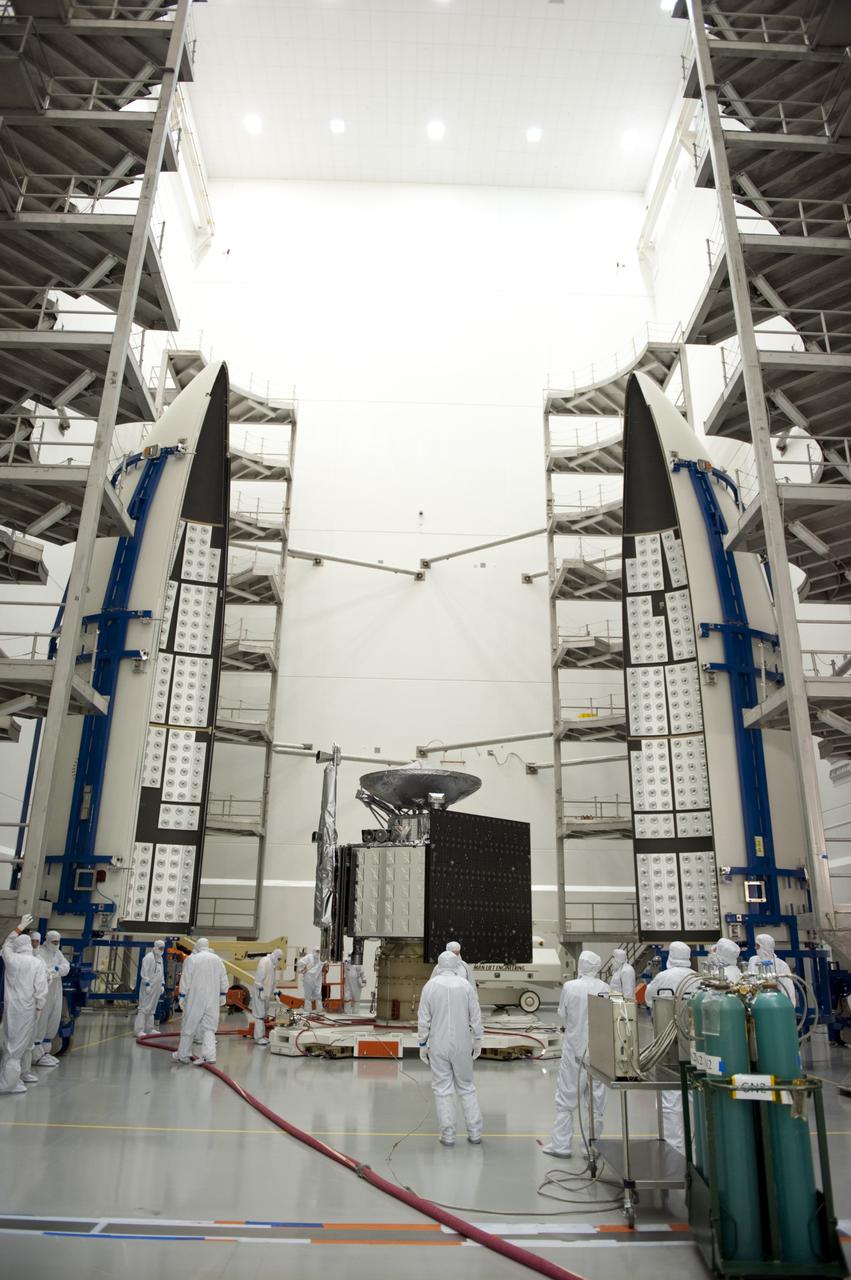 CAPE CANAVERAL, Fla. -- In the Astrotech payload processing facility near Kennedy Space Center in Florida, preparations are under way to enclose the Juno spacecraft in its Atlas payload fairing for launch.    The fairing will protect the spacecraft from the impact of aerodynamic pressure and heating during ascent and will be jettisoned once the spacecraft is outside the Earth's atmosphere. Juno is scheduled to launch aboard a United Launch Alliance Atlas V rocket from Cape Canaveral, Fla., Aug. 5.The solar-powered spacecraft will orbit Jupiter's poles 33 times to find out more about the gas giant's origins, structure, atmosphere and magnetosphere and investigate the existence of a solid planetary core. For more information, visit www.nasa.gov/juno. Photo credit: NASA/Kim Shiflett