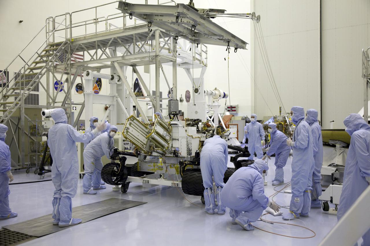 Cape Canaveral, Fla. -- Technicians at the Payload Hazardous Servicing Facility at NASA's Kennedy Space Center in Florida, prepare an overhead crane to move NASA's Mars Science Laboratory (MSL) rover, known as Curiosity, for its move to the high bay floor where the instrument mast and science boom will undergo deployment testing.               A United Launch Alliance Atlas V-541 configuration will be used to loft MSL into space. Curiosity’s 10 science instruments are designed to search for evidence on whether Mars has had environments favorable to microbial life, including chemical ingredients for life.  The unique rover will use a laser to look inside rocks and release its gasses so that the rover’s spectrometer can analyze and send the data back to Earth. MSL is scheduled to launch from Cape Canaveral Air Force Station in Florida Nov. 25 with a window extending to Dec. 18 and arrival at Mars Aug. 2012. For more information, visit http://www.nasa.gov/msl. Photo credit: NASA/Frankie Martin