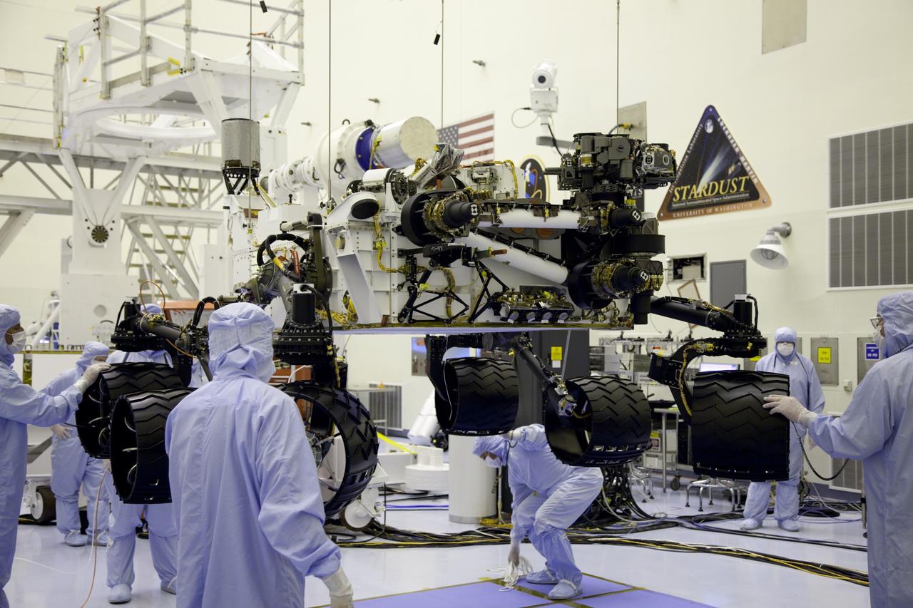 Cape Canaveral, Fla. -- Technicians, at the Payload Hazardous Servicing Facility at NASA's Kennedy Space Center in Florida, use an overhead crane to lower NASA's Mars Science Laboratory (MSL) rover, known as Curiosity, onto the high bay floor where the instrument mast and science boom will undergo deployment testing.           A United Launch Alliance Atlas V-541 configuration will be used to loft MSL into space. Curiosity’s 10 science instruments are designed to search for evidence on whether Mars has had environments favorable to microbial life, including chemical ingredients for life.  The unique rover will use a laser to look inside rocks and release its gasses so that the rover’s spectrometer can analyze and send the data back to Earth. MSL is scheduled to launch from Cape Canaveral Air Force Station in Florida Nov. 25 with a window extending to Dec. 18 and arrival at Mars Aug. 2012. For more information, visit http://www.nasa.gov/msl. Photo credit: NASA/Frankie Martin