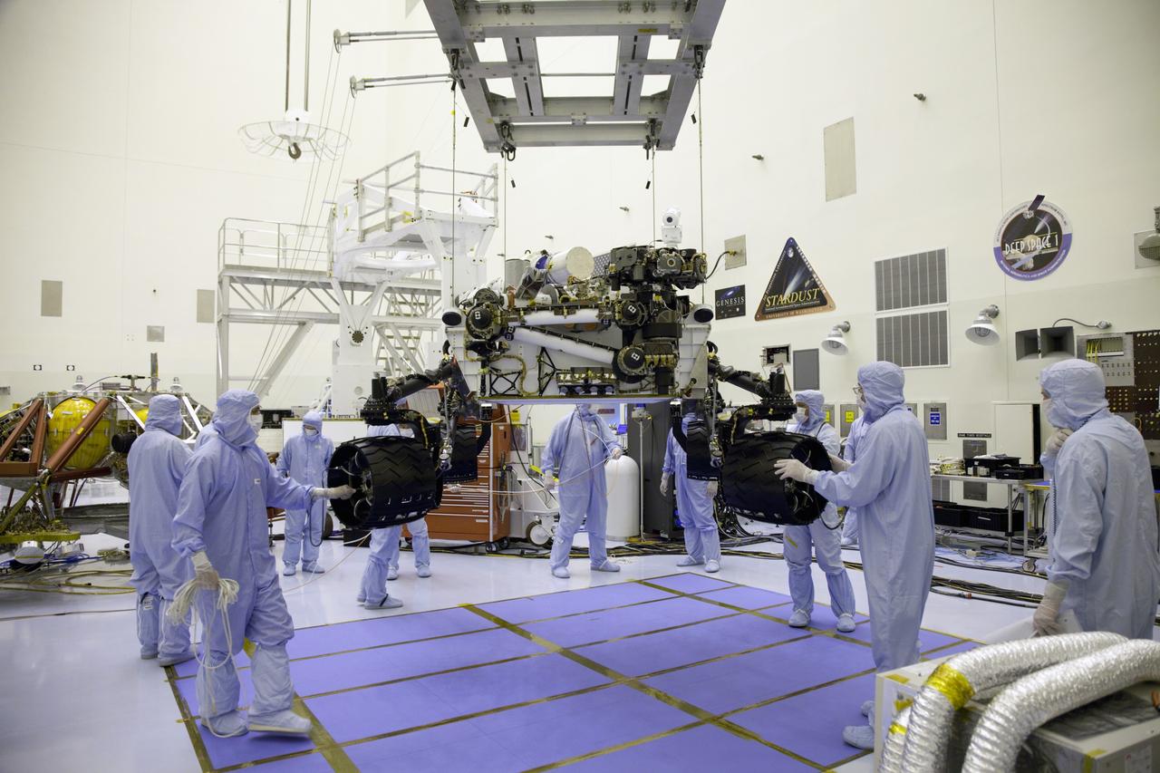 Cape Canaveral, Fla. -- Technicians, at the Payload Hazardous Servicing Facility at NASA's Kennedy Space Center in Florida, use an overhead crane to lower NASA's Mars Science Laboratory (MSL) rover, known as Curiosity, onto the high bay floor where the instrument mast and science boom will undergo deployment testing.           A United Launch Alliance Atlas V-541 configuration will be used to loft MSL into space. Curiosity’s 10 science instruments are designed to search for evidence on whether Mars has had environments favorable to microbial life, including chemical ingredients for life.  The unique rover will use a laser to look inside rocks and release its gasses so that the rover’s spectrometer can analyze and send the data back to Earth. MSL is scheduled to launch from Cape Canaveral Air Force Station in Florida Nov. 25 with a window extending to Dec. 18 and arrival at Mars Aug. 2012. For more information, visit http://www.nasa.gov/msl. Photo credit: NASA/Frankie Martin