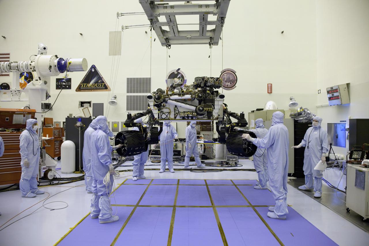 Cape Canaveral, Fla. -- Technicians, at the Payload Hazardous Servicing Facility at NASA's Kennedy Space Center in Florida, use an overhead crane to lower NASA's Mars Science Laboratory (MSL) rover, known as Curiosity, onto the high bay floor where the instrument mast and science boom will undergo deployment testing.           A United Launch Alliance Atlas V-541 configuration will be used to loft MSL into space. Curiosity’s 10 science instruments are designed to search for evidence on whether Mars has had environments favorable to microbial life, including chemical ingredients for life.  The unique rover will use a laser to look inside rocks and release its gasses so that the rover’s spectrometer can analyze and send the data back to Earth. MSL is scheduled to launch from Cape Canaveral Air Force Station in Florida Nov. 25 with a window extending to Dec. 18 and arrival at Mars Aug. 2012. For more information, visit http://www.nasa.gov/msl. Photo credit: NASA/Frankie Martin