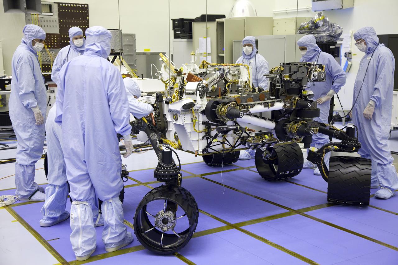 Cape Canaveral, Fla. -- Technicians, at the Payload Hazardous Servicing Facility at NASA's Kennedy Space Center in Florida, have lowered NASA's Mars Science Laboratory (MSL) rover, known as Curiosity, onto the high bay floor where its instrument mast and science boom will undergo deployment testing.              A United Launch Alliance Atlas V-541 configuration will be used to loft MSL into space. Curiosity’s 10 science instruments are designed to search for evidence on whether Mars has had environments favorable to microbial life, including chemical ingredients for life.  The unique rover will use a laser to look inside rocks and release its gasses so that the rover’s spectrometer can analyze and send the data back to Earth. MSL is scheduled to launch from Cape Canaveral Air Force Station in Florida Nov. 25 with a window extending to Dec. 18 and arrival at Mars Aug. 2012. For more information, visit http://www.nasa.gov/msl. Photo credit: NASA/Frankie Martin