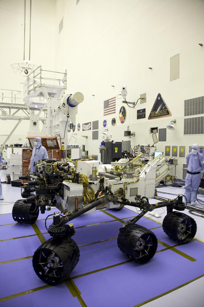 Cape Canaveral, Fla. -- Technicians, at the Payload Hazardous Servicing Facility at NASA's Kennedy Space Center in Florida, prepare NASA's Mars Science Laboratory (MSL) rover, known as Curiosity, for instrument mast and science boom deployment testing.                 A United Launch Alliance Atlas V-541 configuration will be used to loft MSL into space. Curiosity’s 10 science instruments are designed to search for evidence on whether Mars has had environments favorable to microbial life, including chemical ingredients for life.  The unique rover will use a laser to look inside rocks and release its gasses so that the rover’s spectrometer can analyze and send the data back to Earth. MSL is scheduled to launch from Cape Canaveral Air Force Station in Florida Nov. 25 with a window extending to Dec. 18 and arrival at Mars Aug. 2012. For more information, visit http://www.nasa.gov/msl. Photo credit: NASA/Frankie Martin