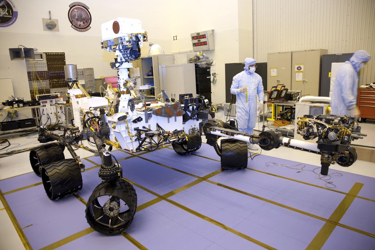 Cape Canaveral, Fla. -- Technicians at the Payload Hazardous Servicing Facility at NASA's Kennedy Space Center in Florida, put the instrument mast and science boom on NASA's Mars Science Laboratory (MSL) rover, known as Curiosity, through a series of deployment tests.             A United Launch Alliance Atlas V-541 configuration will be used to loft MSL into space. Curiosity’s 10 science instruments are designed to search for evidence on whether Mars has had environments favorable to microbial life, including chemical ingredients for life.  The unique rover will use a laser to look inside rocks and release its gasses so that the rover’s spectrometer can analyze and send the data back to Earth. MSL is scheduled to launch from Cape Canaveral Air Force Station in Florida Nov. 25 with a window extending to Dec. 18 and arrival at Mars Aug. 2012. For more information, visit http://www.nasa.gov/msl. Photo credit: NASA/Frankie Martin