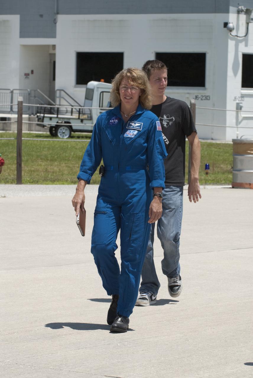 CAPE CANAVERAL, Fla. -- The STS-135 astronauts prepare to depart NASA's Kennedy Space Center in Florida to return to NASA's Johnson Space Center in Houston. Space shuttle Atlantis and its crew touched down on Kennedy's Shuttle Landing Facility runway 5:57 a.m., July 21, 2011, bringing a close to 30 years of space shuttle missions. Here, STS-135 Mission Specialist Sandy Magnus walks toward a Gulfstream III jet that will take her back home. Securing the space shuttle fleet's place in history, Atlantis marked the 26th nighttime landing of the Space Shuttle Program and the 78th landing at Kennedy. Atlantis and its crew delivered to the International Space Station the Raffaello multi-purpose logistics module packed with more than 9,400 pounds of spare parts, equipment and supplies that will sustain station operations for the next year. STS-135 was the 33rd and final flight for Atlantis and the final mission of the Space Shuttle Program. For more information, visit www.nasa.gov/mission_pages/shuttle/shuttlemissions/sts135/index.html. Photo credit: NASA/Kim Shiflett