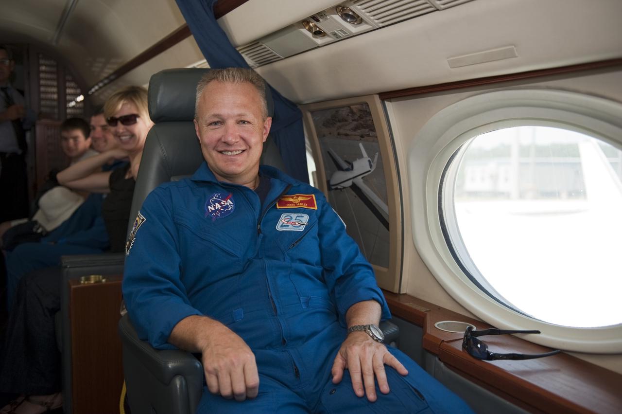 CAPE CANAVERAL, Fla. -- At NASA Kennedy Space Center's Shuttle Landing Facility, STS-135 Pilot Doug Hurley is seated in a Gulfstream III jet that will fly him and his family back to NASA's Johnson Space Center in Houston.       Space shuttle Atlantis and its crew touched down on Kennedy's Shuttle Landing Facility runway 5:57 a.m., July 21, 2011, bringing a close to 30 years of space shuttle missions. Securing the space shuttle fleet's place in history, Atlantis marked the 26th nighttime landing of the Space Shuttle Program and the 78th landing at Kennedy. Atlantis and its crew delivered to the International Space Station the Raffaello multi-purpose logistics module packed with more than 9,400 pounds of spare parts, equipment and supplies that will sustain station operations for the next year. STS-135 was the 33rd and final flight for Atlantis and the final mission of the Space Shuttle Program. For more information, visit www.nasa.gov/mission_pages/shuttle/shuttlemissions/sts135/index.html. Photo credit: NASA/Kim Shiflett