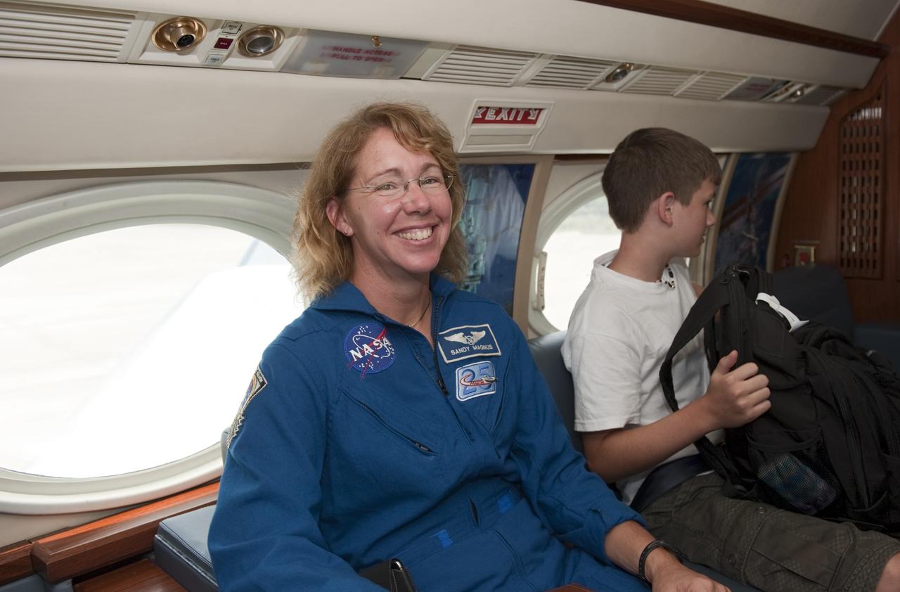 CAPE CANAVERAL, Fla. -- At NASA Kennedy Space Center's Shuttle Landing Facility, STS-135 Mission Specialist Sandy Magnus is seated in a Gulfstream III jet that will fly her back to NASA's Johnson Space Center in Houston.         Space shuttle Atlantis and its crew touched down on Kennedy's Shuttle Landing Facility runway 5:57 a.m., July 21, 2011, bringing a close to 30 years of space shuttle missions. Securing the space shuttle fleet's place in history, Atlantis marked the 26th nighttime landing of the Space Shuttle Program and the 78th landing at Kennedy. Atlantis and its crew delivered to the International Space Station the Raffaello multi-purpose logistics module packed with more than 9,400 pounds of spare parts, equipment and supplies that will sustain station operations for the next year. STS-135 was the 33rd and final flight for Atlantis and the final mission of the Space Shuttle Program. For more information, visit www.nasa.gov/mission_pages/shuttle/shuttlemissions/sts135/index.html. Photo credit: NASA/Kim Shiflett