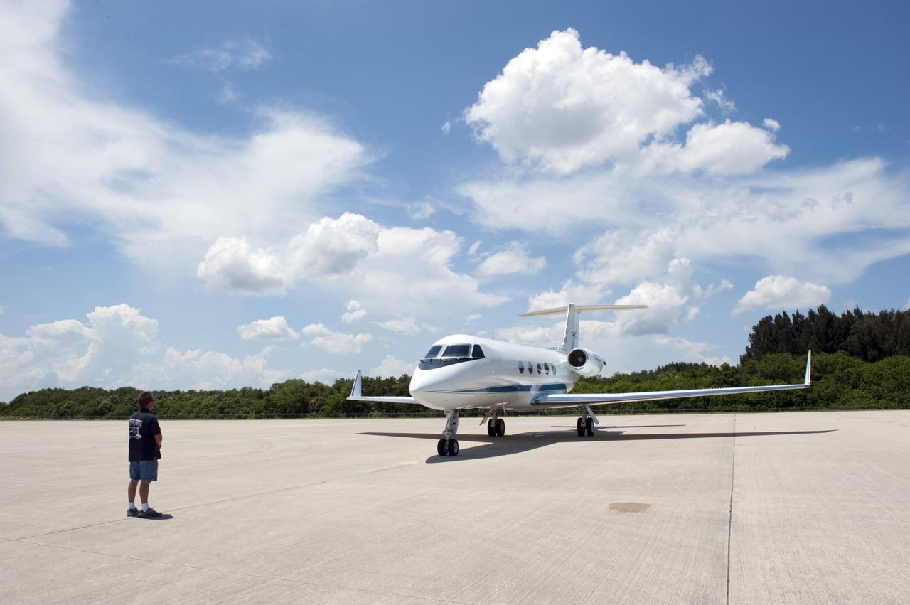 CAPE CANAVERAL, Fla. -- At NASA Kennedy Space Center's Shuttle Landing Facility, a Gulfstream III jet is preparing to take off with space shuttle Atlantis' four STS-135 astronauts and their families for the return trip home to NASA's Johnson Space Center in Houston.    Space shuttle Atlantis and its crew touched down on Kennedy's Shuttle Landing Facility runway 5:57 a.m., July 21, 2011, bringing a close to 30 years of space shuttle missions. Securing the space shuttle fleet's place in history, Atlantis marked the 26th nighttime landing of the Space Shuttle Program and the 78th landing at Kennedy. Atlantis and its crew delivered to the International Space Station the Raffaello multi-purpose logistics module packed with more than 9,400 pounds of spare parts, equipment and supplies that will sustain station operations for the next year. STS-135 was the 33rd and final flight for Atlantis and the final mission of the Space Shuttle Program. For more information, visit www.nasa.gov/mission_pages/shuttle/shuttlemissions/sts135/index.html. Photo credit: NASA/Kim Shiflett
