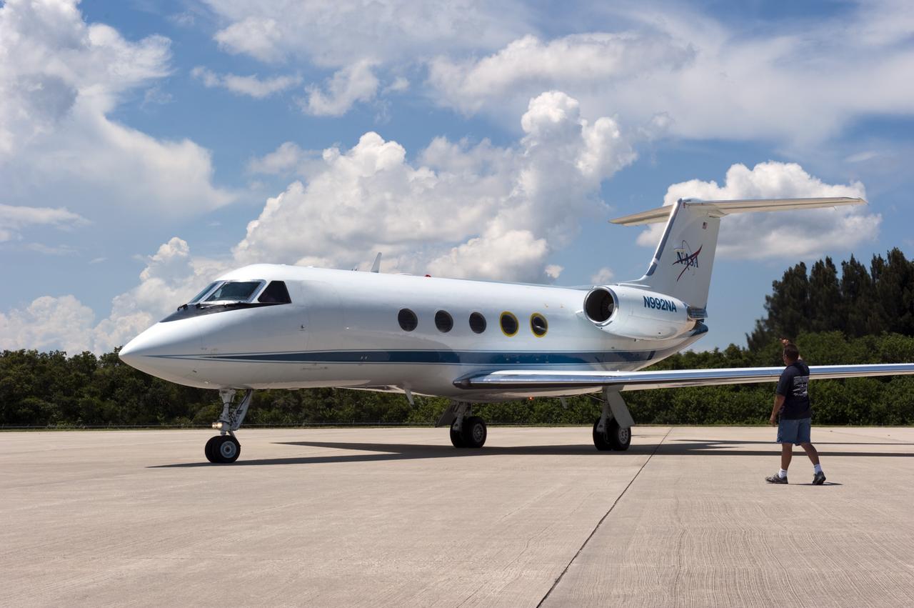 CAPE CANAVERAL, Fla. -- At NASA Kennedy Space Center's Shuttle Landing Facility, a Gulfstream III jet is preparing to take off with space shuttle Atlantis' four STS-135 astronauts and their families for the return trip home to NASA's Johnson Space Center in Houston.    Space shuttle Atlantis and its crew touched down on Kennedy's Shuttle Landing Facility runway 5:57 a.m., July 21, 2011, bringing a close to 30 years of space shuttle missions. Securing the space shuttle fleet's place in history, Atlantis marked the 26th nighttime landing of the Space Shuttle Program and the 78th landing at Kennedy. Atlantis and its crew delivered to the International Space Station the Raffaello multi-purpose logistics module packed with more than 9,400 pounds of spare parts, equipment and supplies that will sustain station operations for the next year. STS-135 was the 33rd and final flight for Atlantis and the final mission of the Space Shuttle Program. For more information, visit www.nasa.gov/mission_pages/shuttle/shuttlemissions/sts135/index.html. Photo credit: NASA/Kim Shiflett
