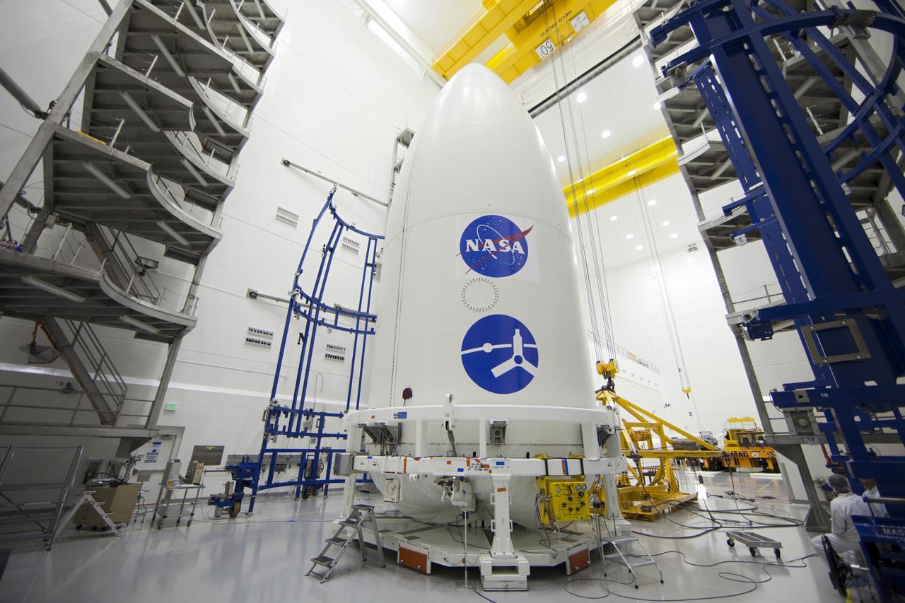 CAPE CANAVERAL, Fla. -- In the Astrotech payload processing facility near Kennedy Space Center in Florida, preparations are under way to lift the Juno spacecraft, enclosed in an Atlas payload fairing, onto a transporter for its trip to Space Launch Complex 41.    The fairing will protect the spacecraft from the impact of aerodynamic pressure and heating during ascent and will be jettisoned once the spacecraft is outside the Earth's atmosphere. Juno is scheduled to launch aboard a United Launch Alliance Atlas V rocket from Cape Canaveral, Fla., Aug. 5.The solar-powered spacecraft will orbit Jupiter's poles 33 times to find out more about the gas giant's origins, structure, atmosphere and magnetosphere and investigate the existence of a solid planetary core. For more information, visit www.nasa.gov/juno. Photo credit: NASA/Frank Michaux